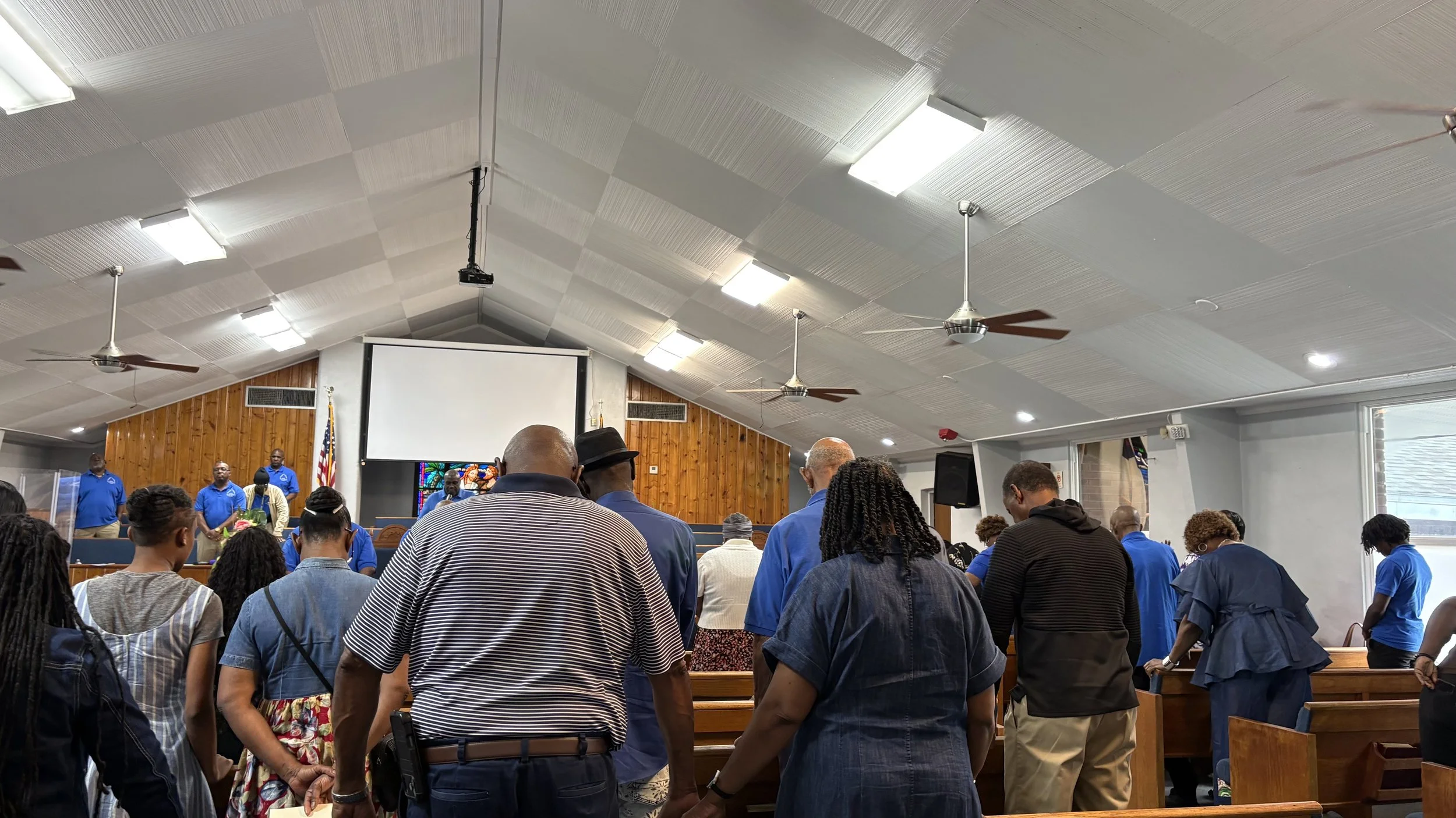 People praying in a church during a service.