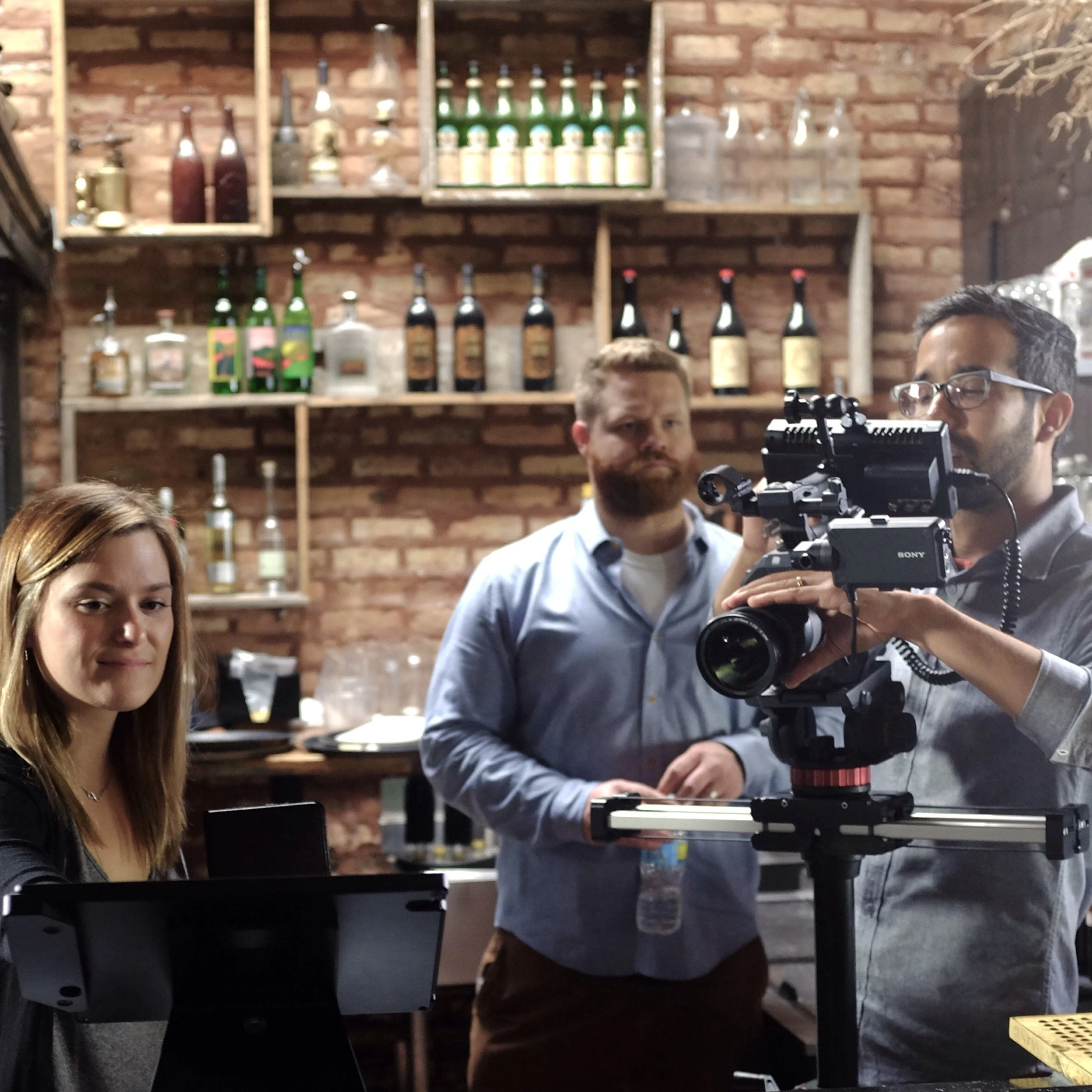 Behind the scenes photo of crew filming talent