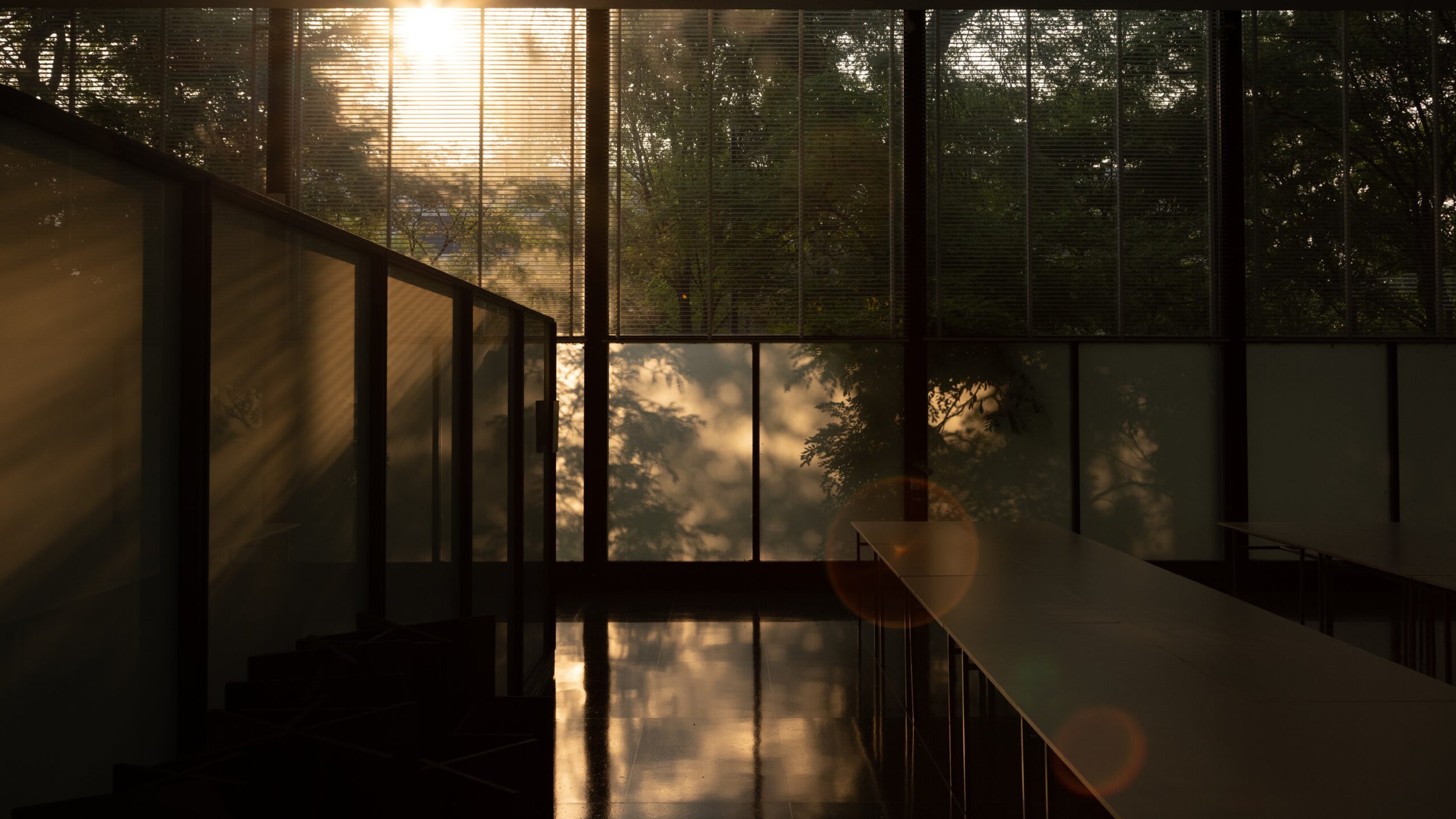 Dark, moody photo of the interior of Crown Hall at IIT