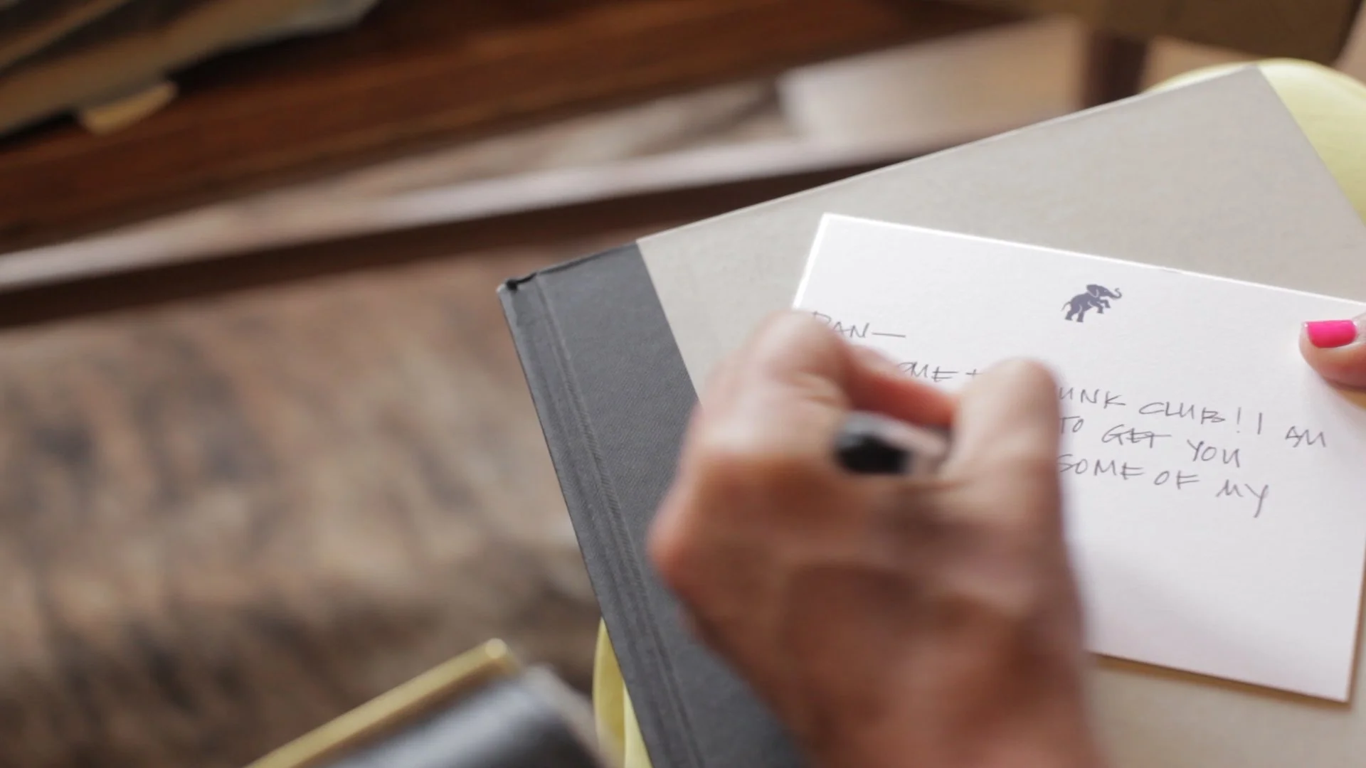Close up of hand written note being written