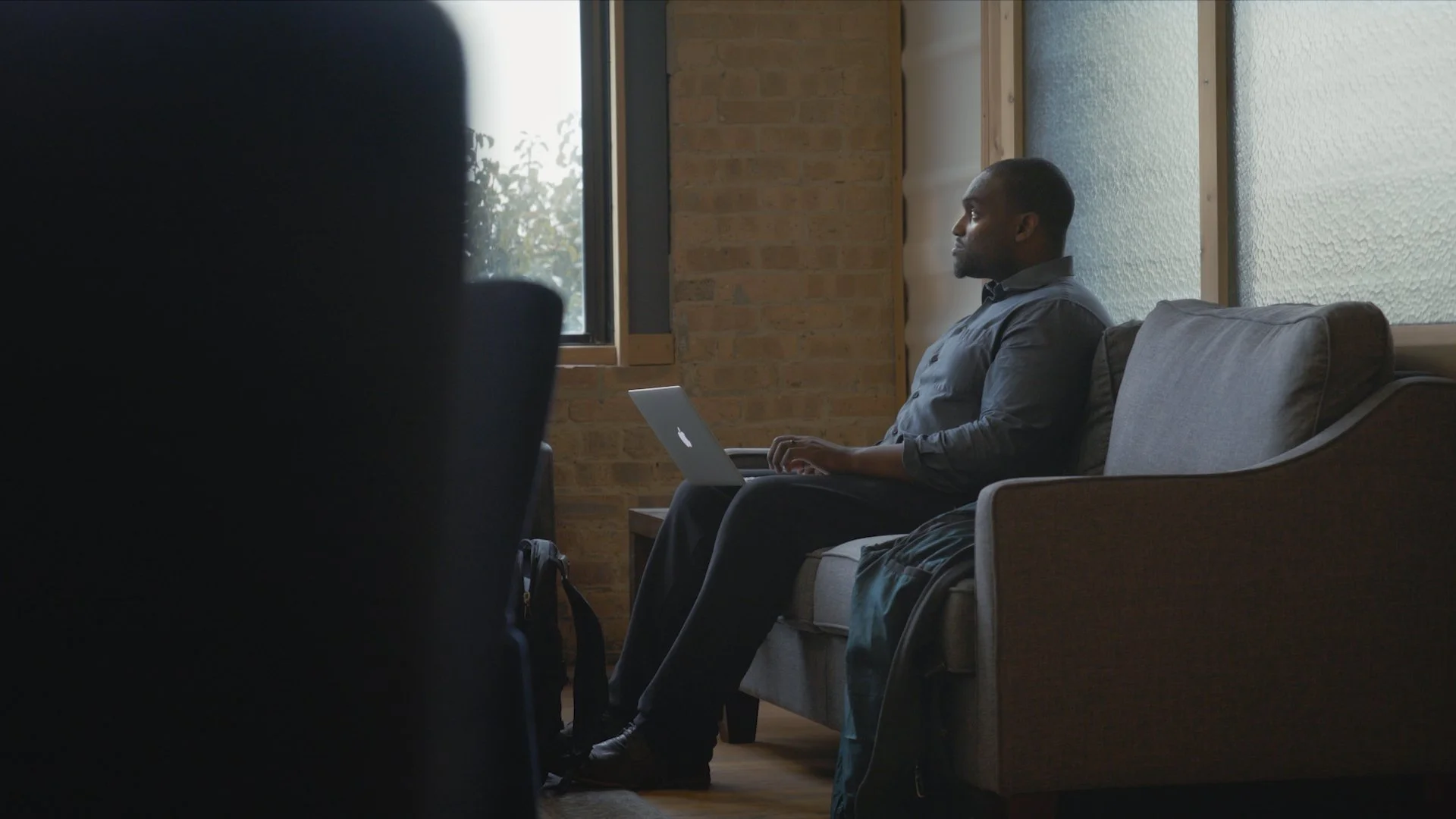 Emile Cambry sitting on couch