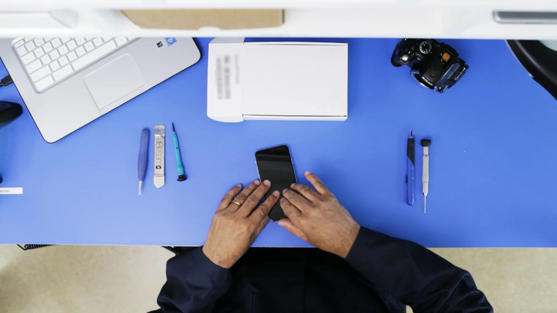 Top view down shot of phone being fixed