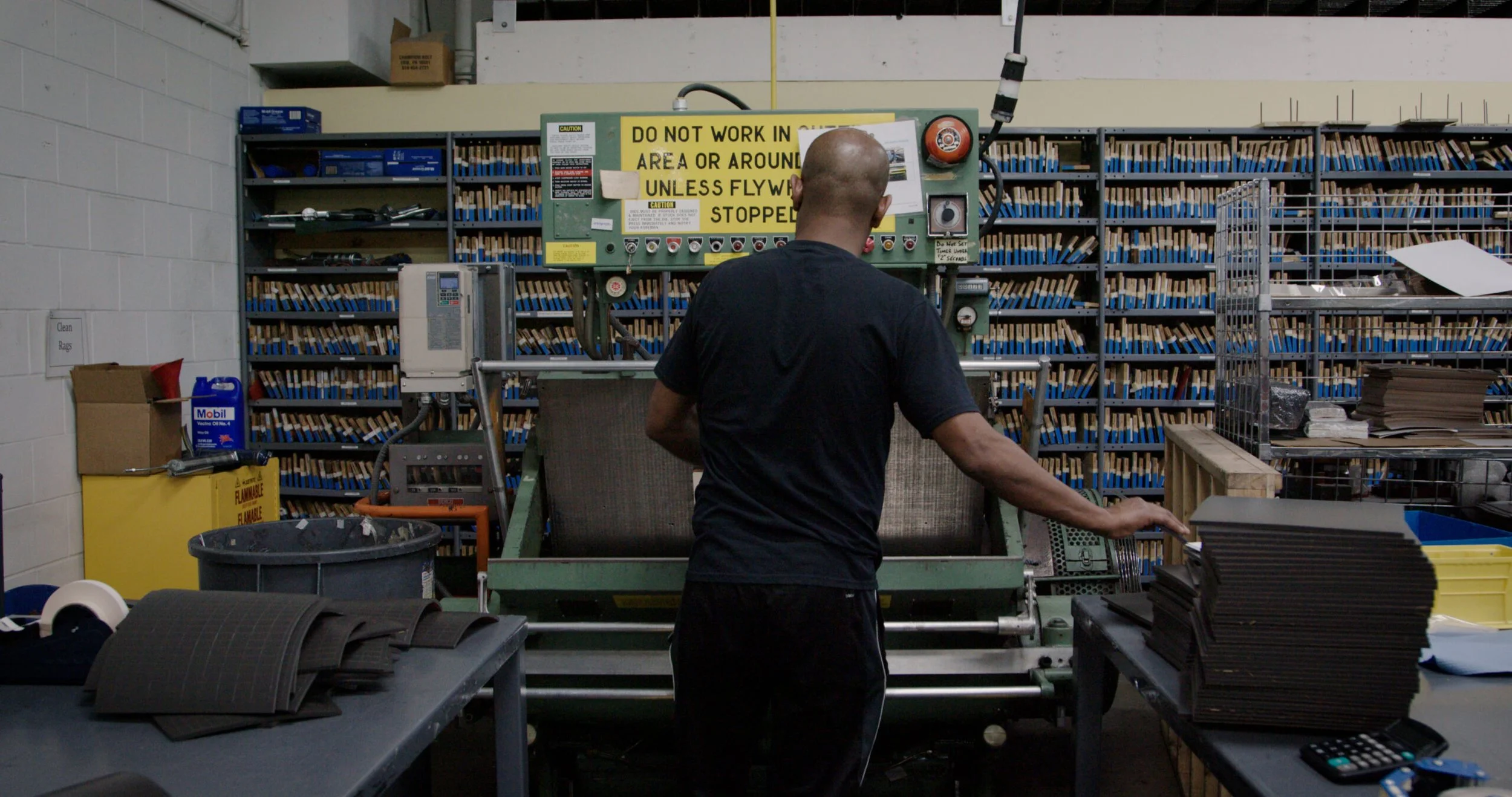 Press operator working with a die cutting machine
