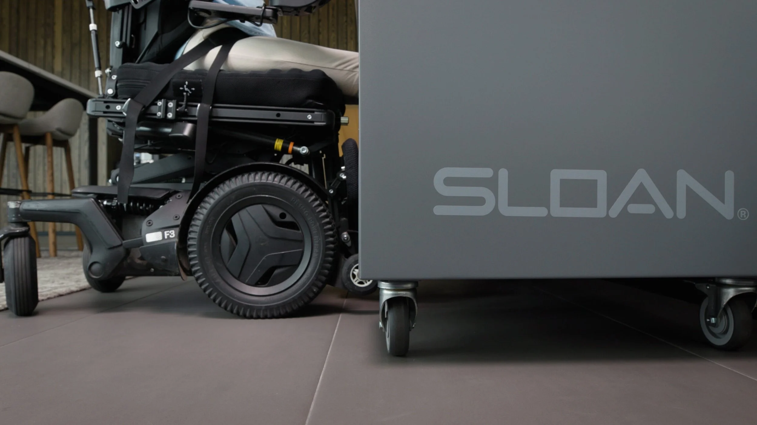 Closeup shot of wheelchair easily fitting under Sloan Mobile Handwashing Statio