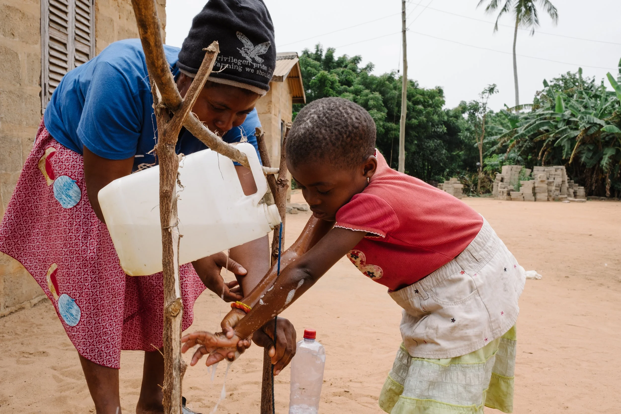 Rudimentary hand washing station in small village in Ghana with no running water