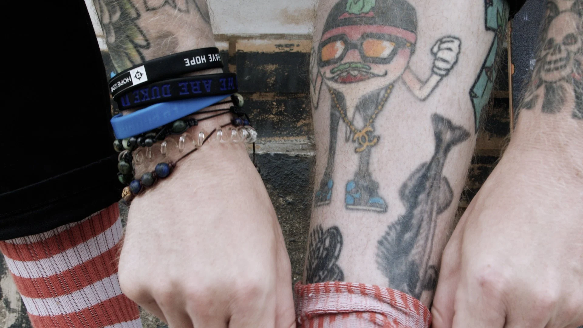 Production still, close up of socks being pulled up