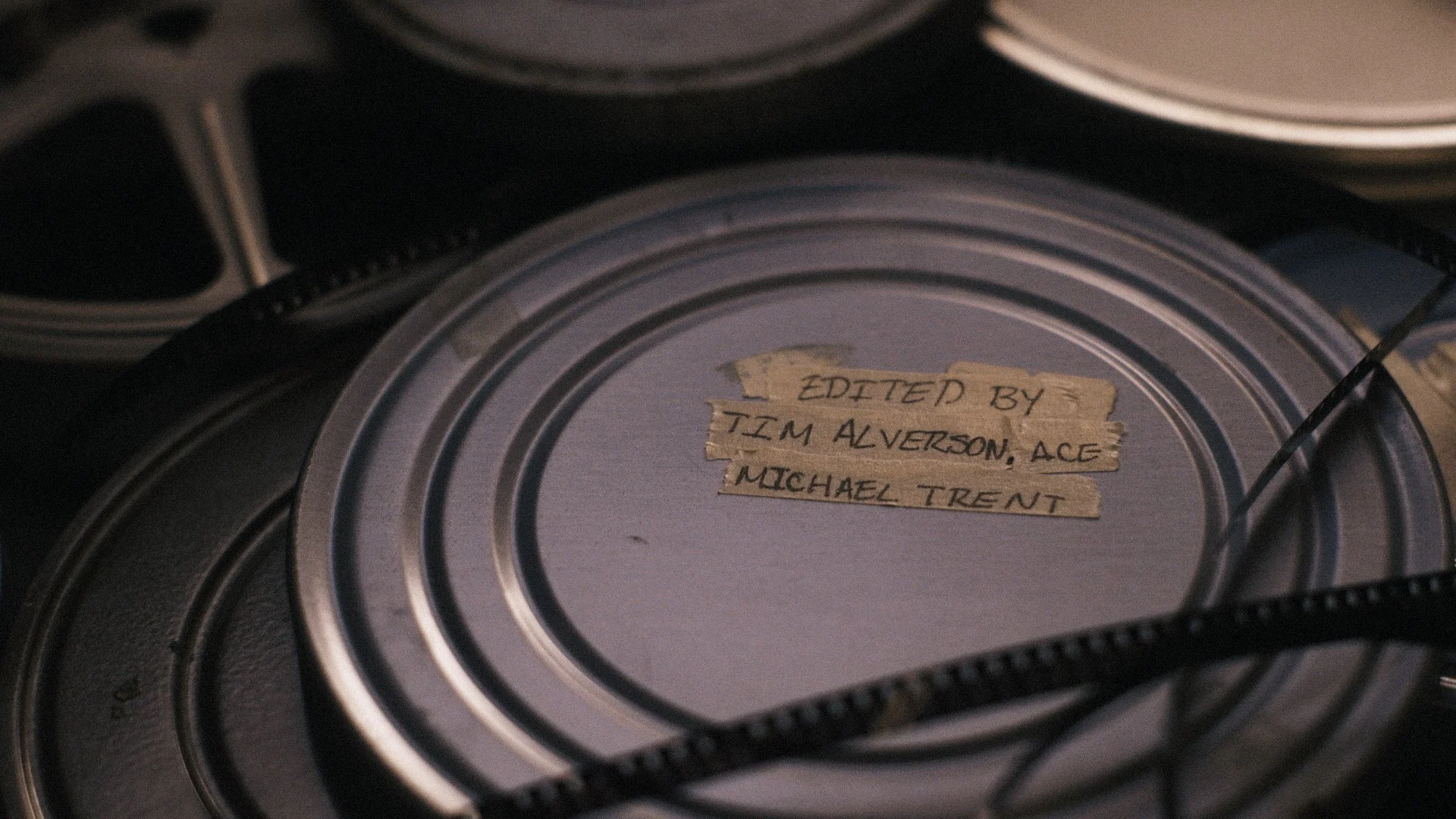 Old film reels scattered on table