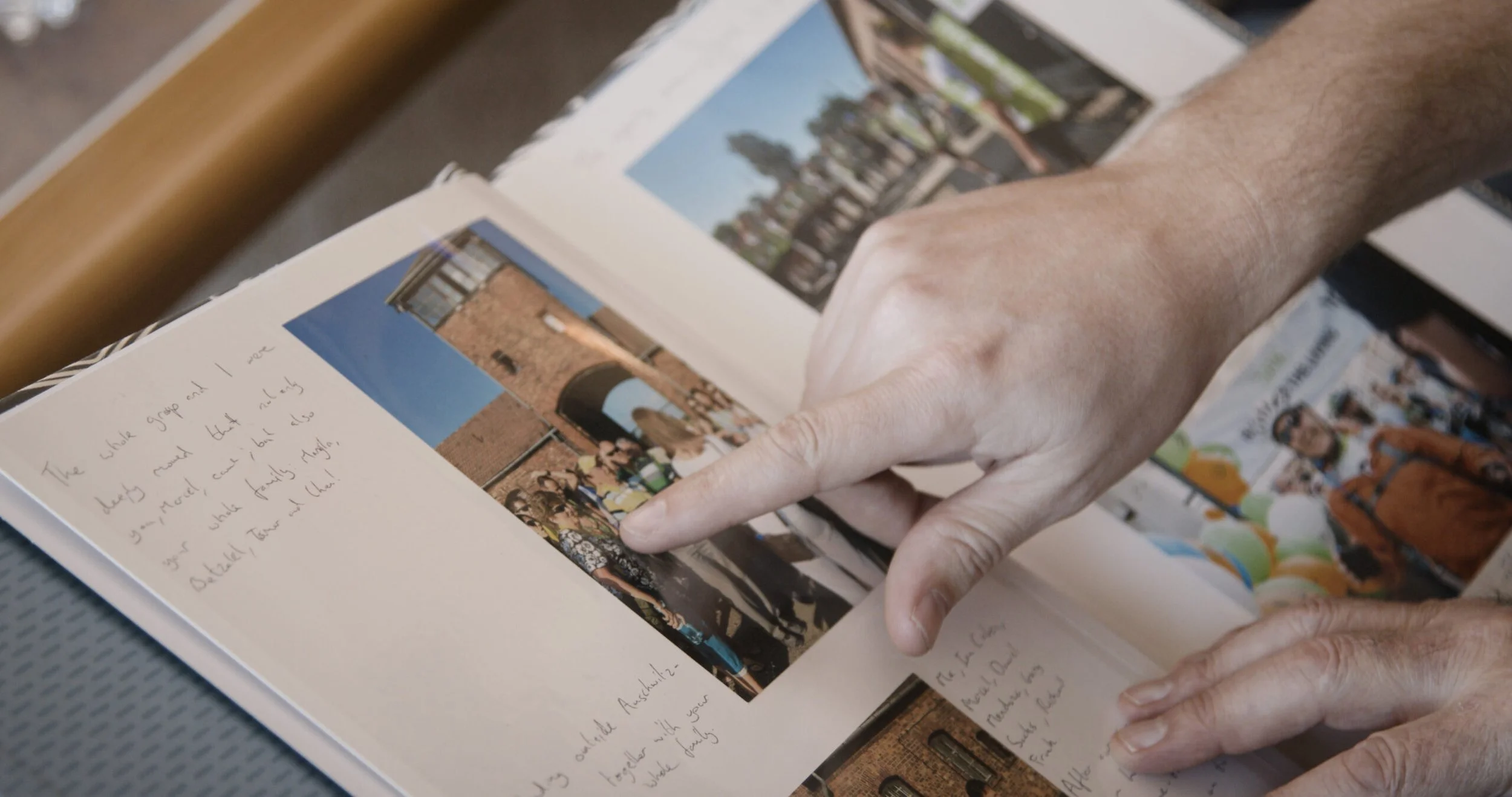 Close up of two people looking through a photo album