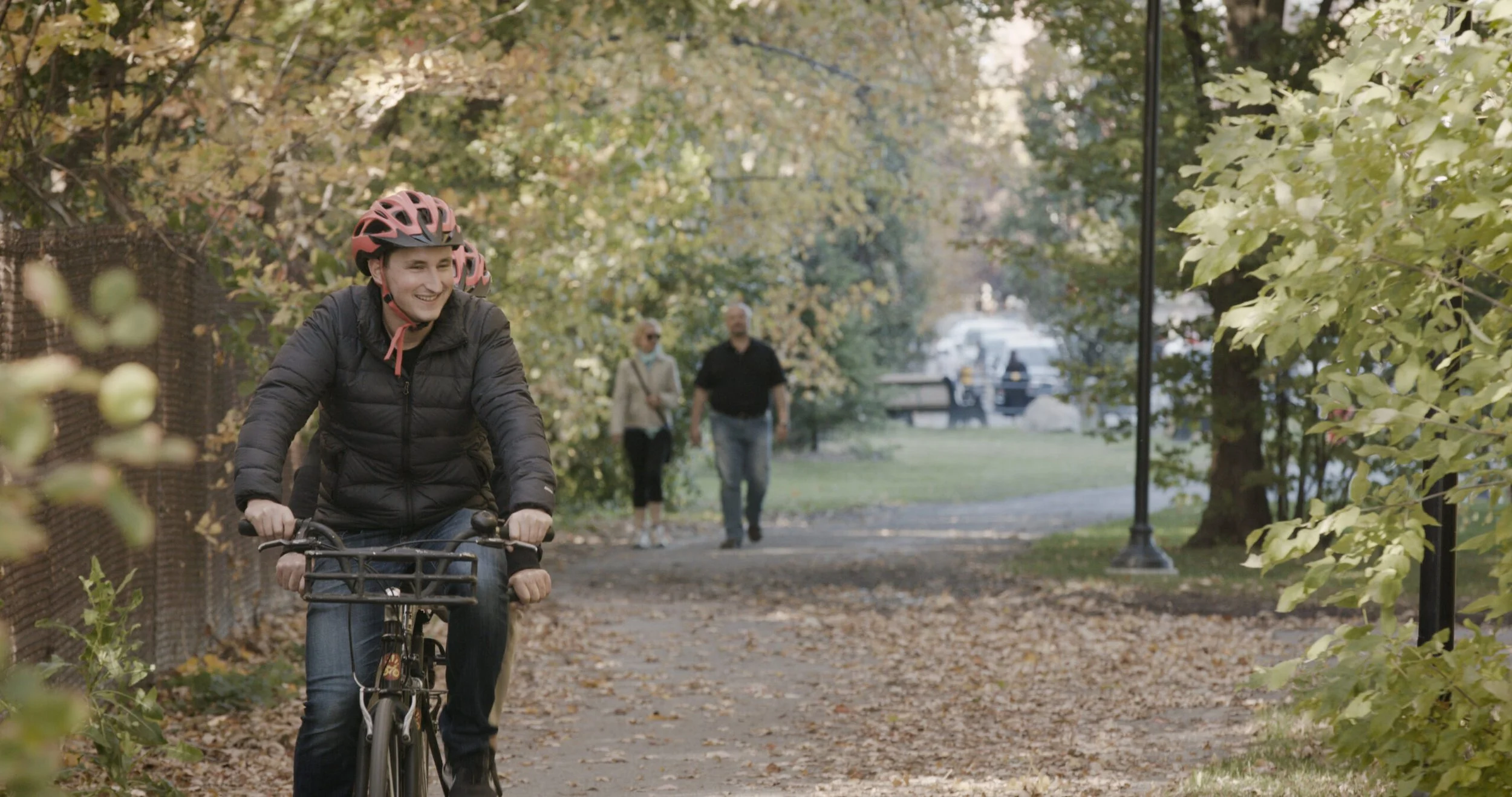 Tandem bike ride through a park
