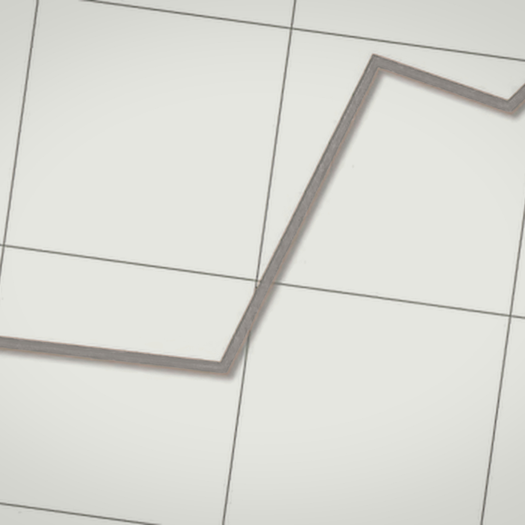 A metallic zigzag-shaped object on a white tiled surface.