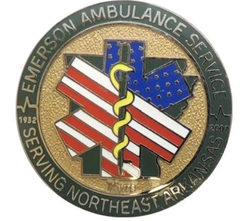 Emblems of the Emerson Ambulance Service and Southeast Ambulance Service, featuring the Texas state outline, a caduceus symbol, and the years 1932 and 1988.
