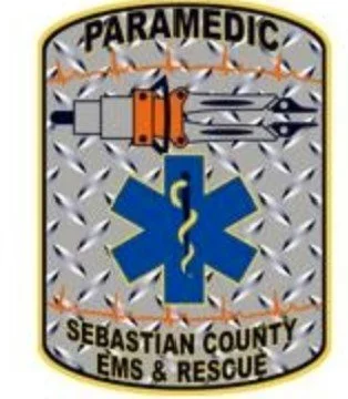 Paramedic patch for Sebastian County EMS & Rescue featuring a star of life symbol, a medical staff, and a rescue tool.