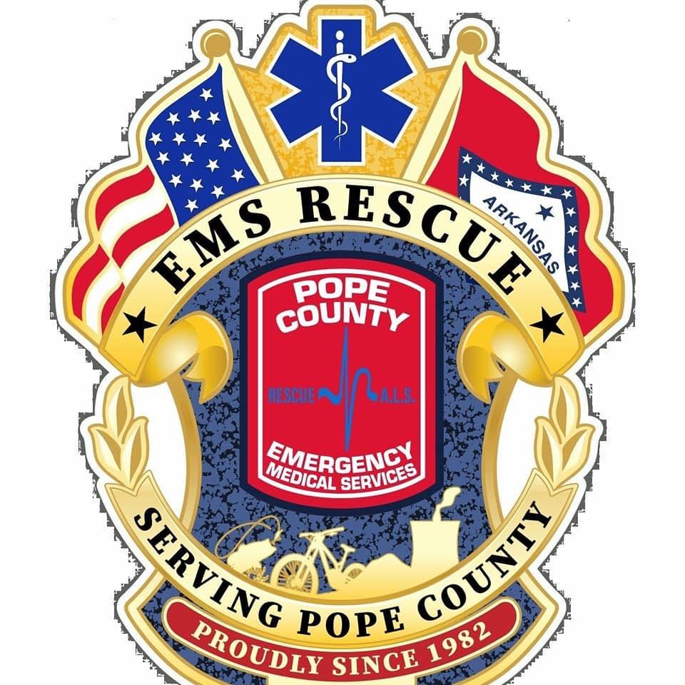 EMTS Rescue badge with American flag, Arkansas flag, medical symbol, and text indicating EMTS rescue serving Pope County since 1982.