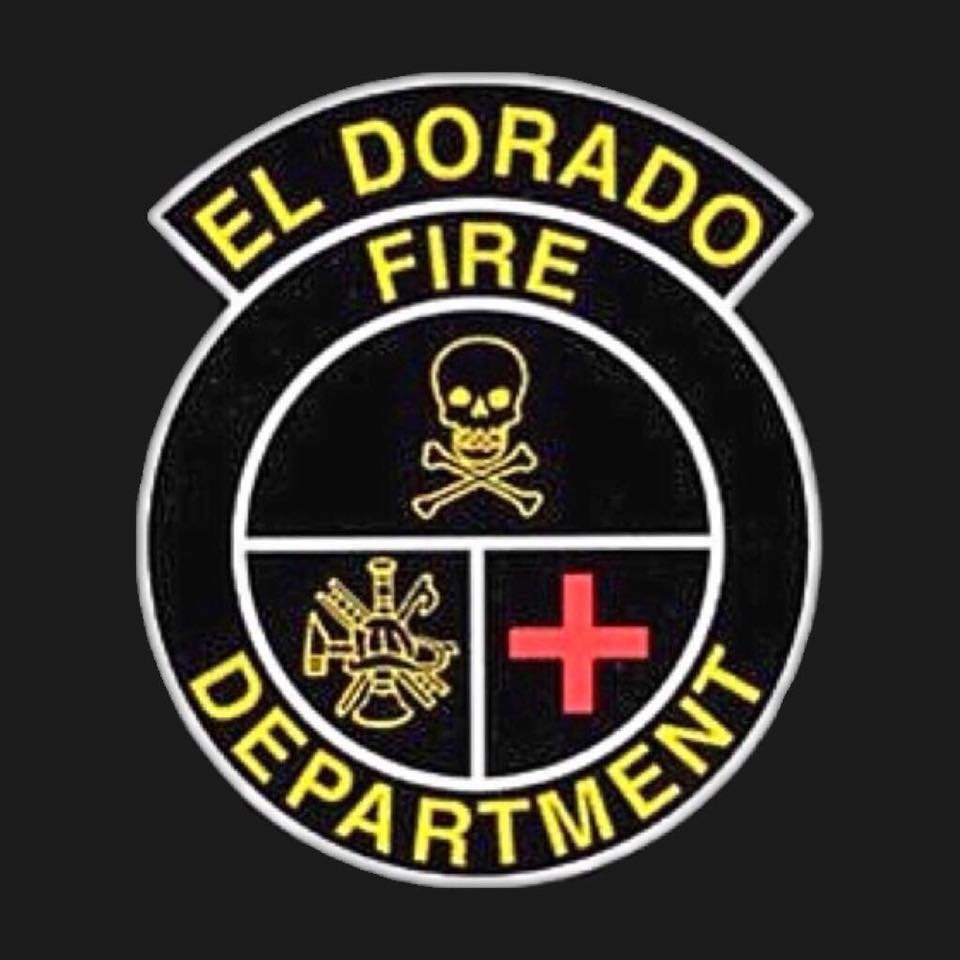 Emblem for El Dorado Fire Department featuring a skull, an axe, a water hose, and a medical cross inside a circular design with black, yellow, and red colors.