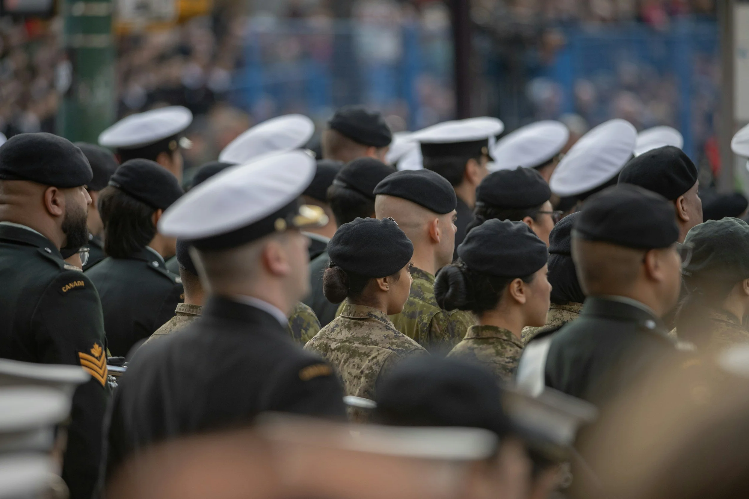 Soldiers in uniform assembled together.