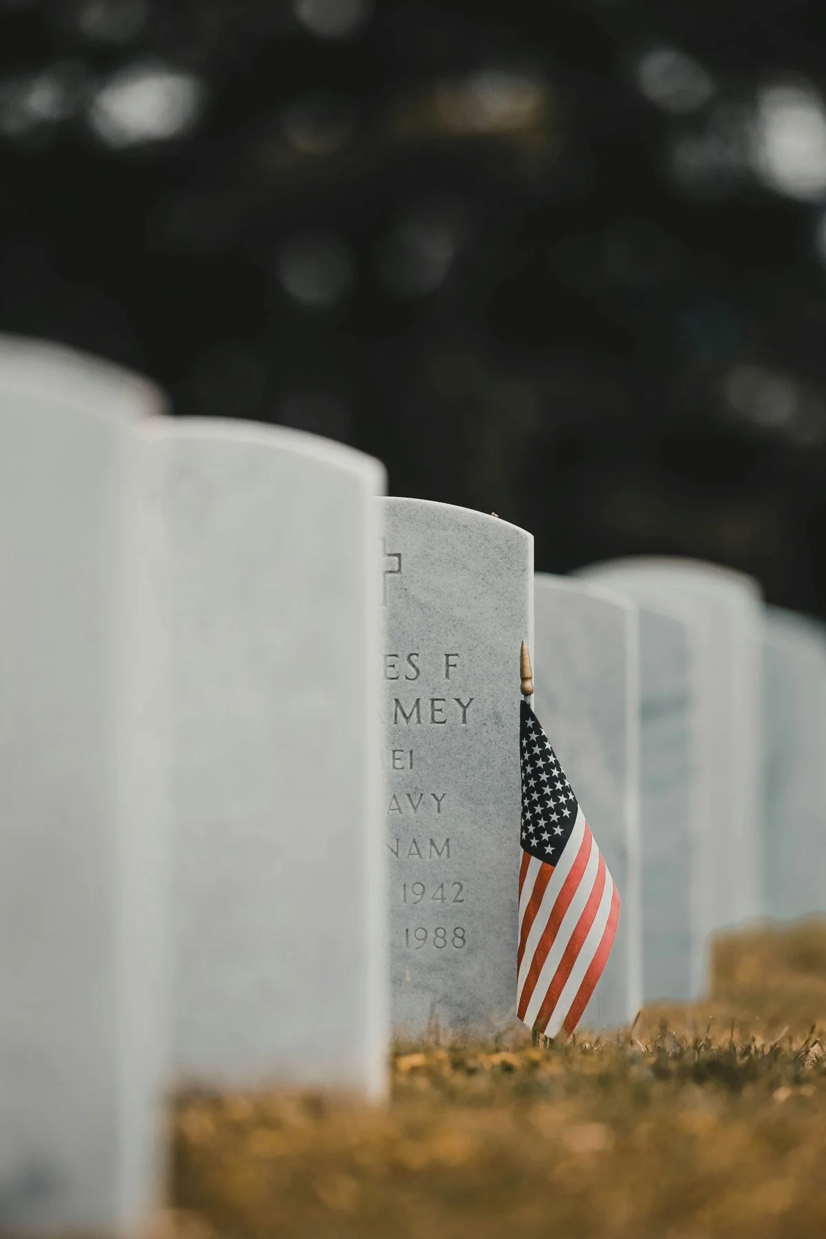 A line of graves honoring military, first responders, and Christian missionaries.