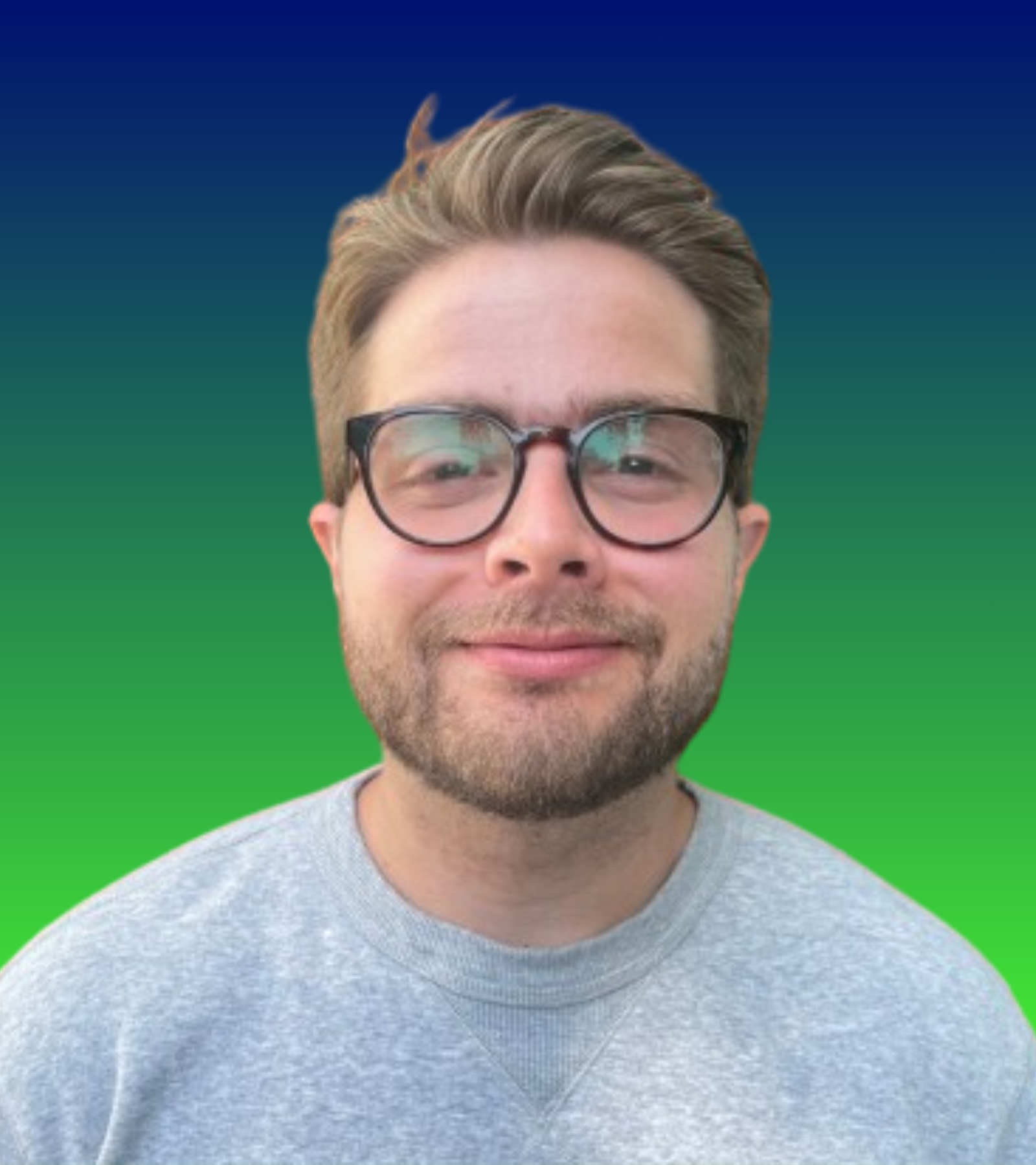 A man with short brown hair, glasses, and a beard, smiling, against a colorful gradient background from dark blue to green.