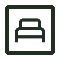 A dark green sign with a bed icon, indicating a hotel or sleeping accommodation.