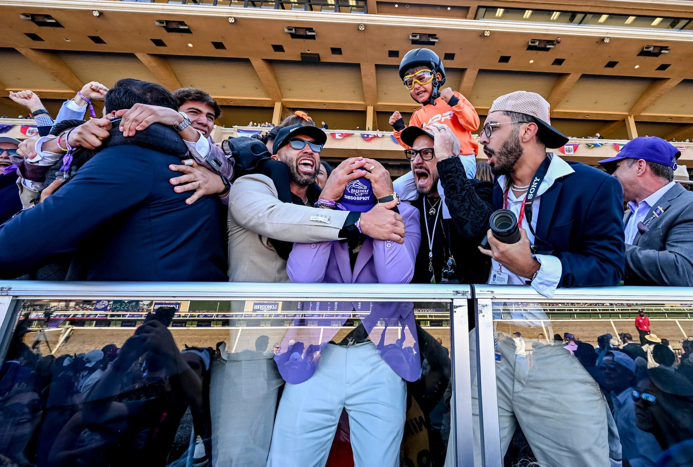 Owners celebrating together after a race at the racetrack