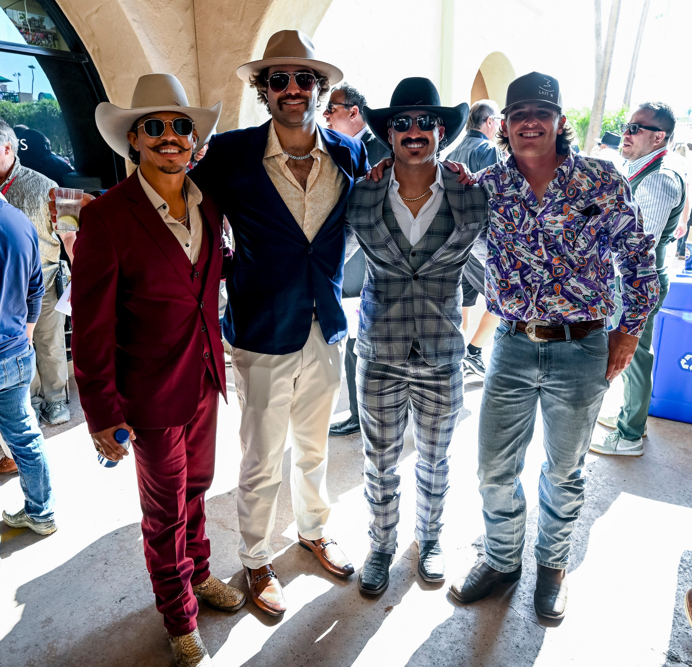 Group of friends dressed up at the racetrack, showing the social and approachable side of getting started in racehorse ownership