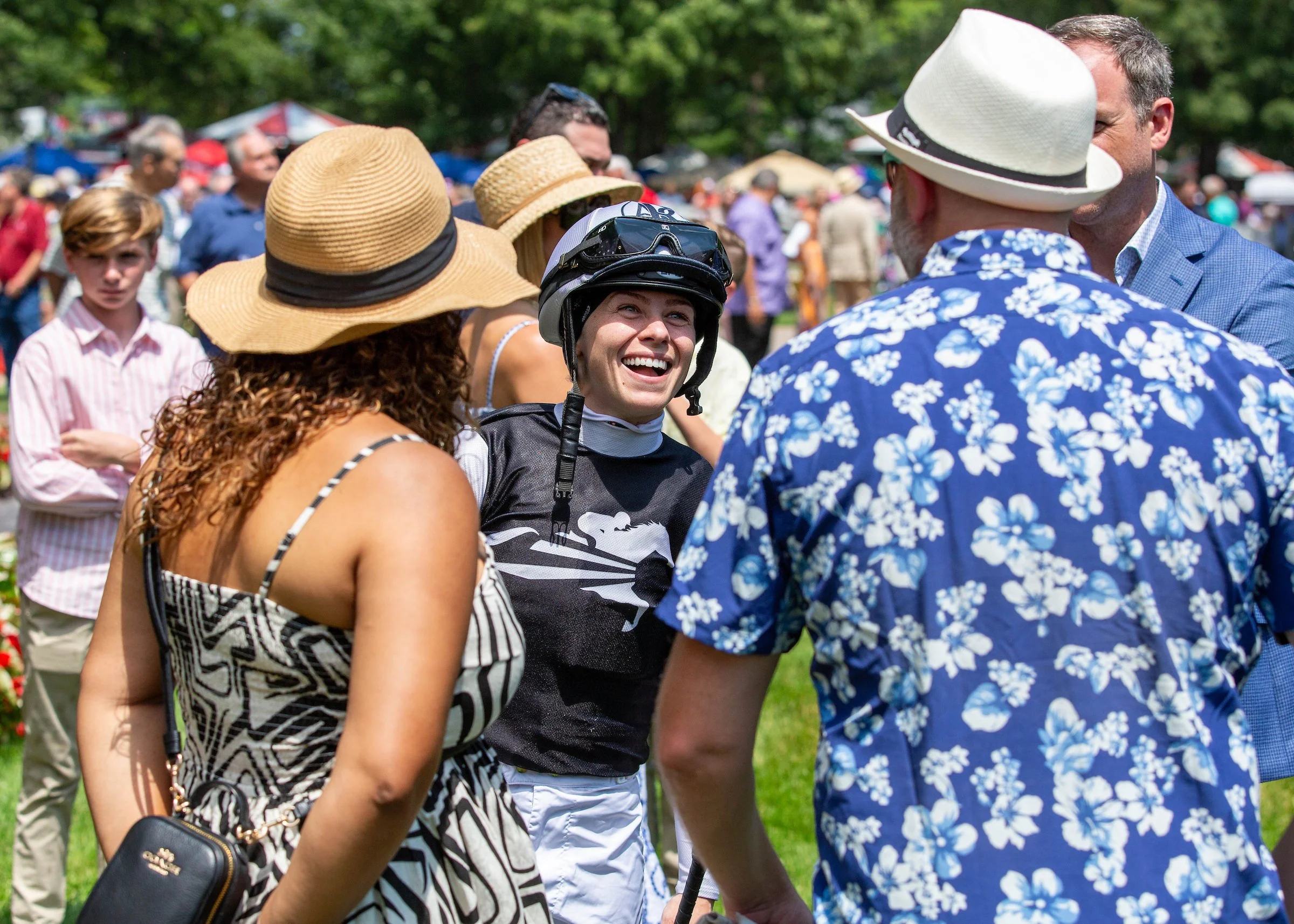 Syndicate owners connecting in a small group at the racetrack