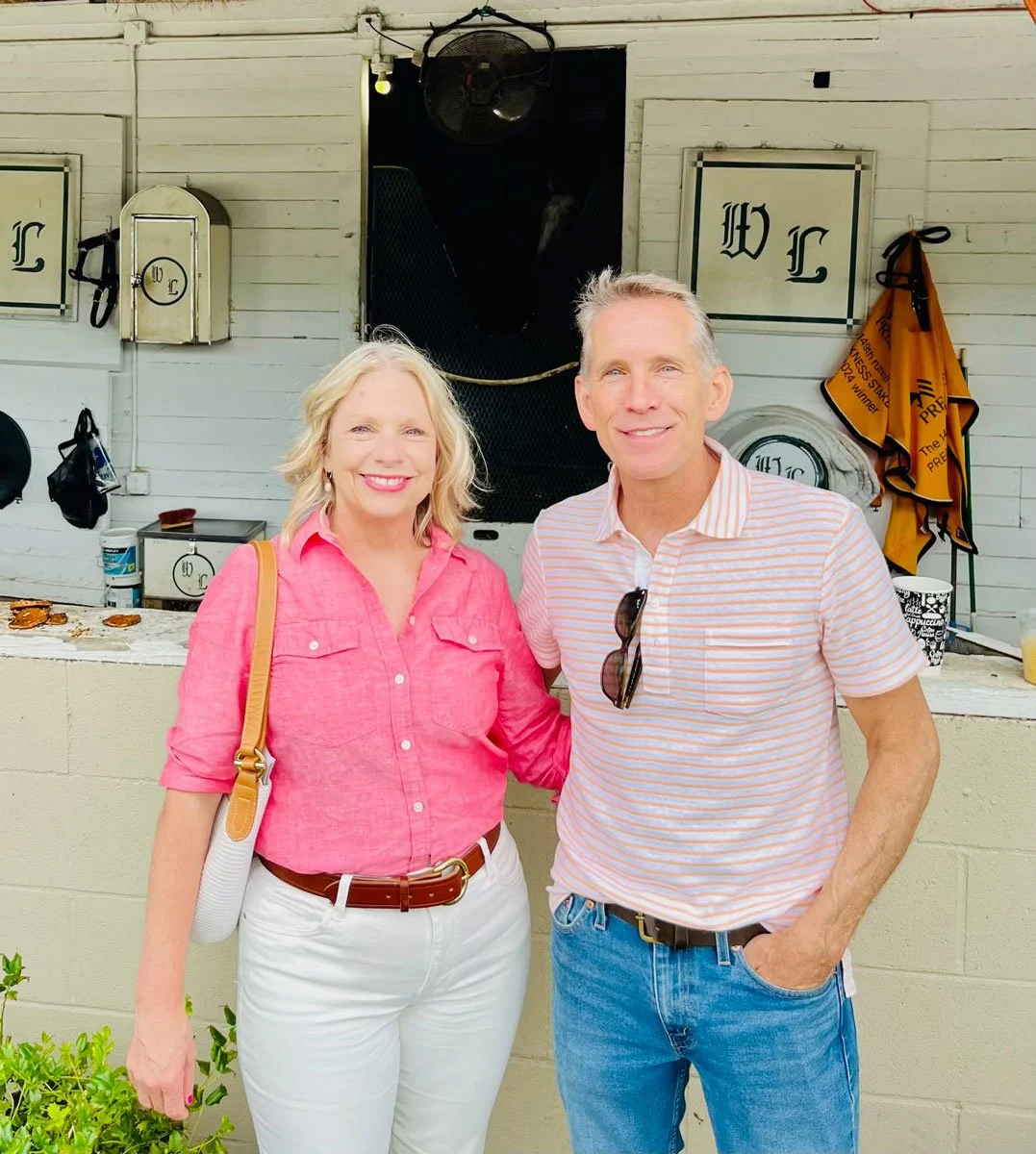 Racehorse owners at a stable