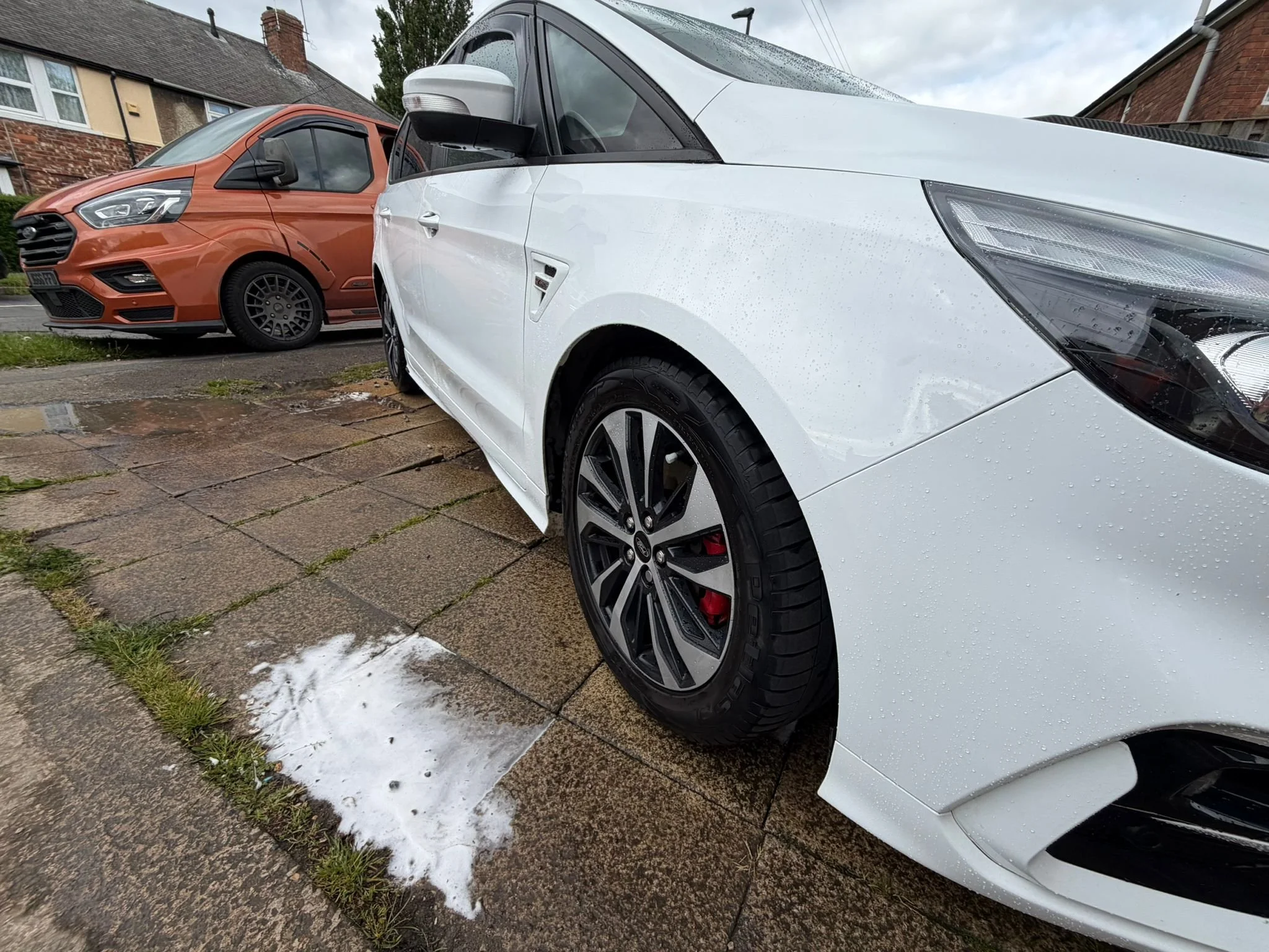 666 Valeting mobile car wash – clean white car with detailed alloy wheels and water beading finish. York mobile valeting