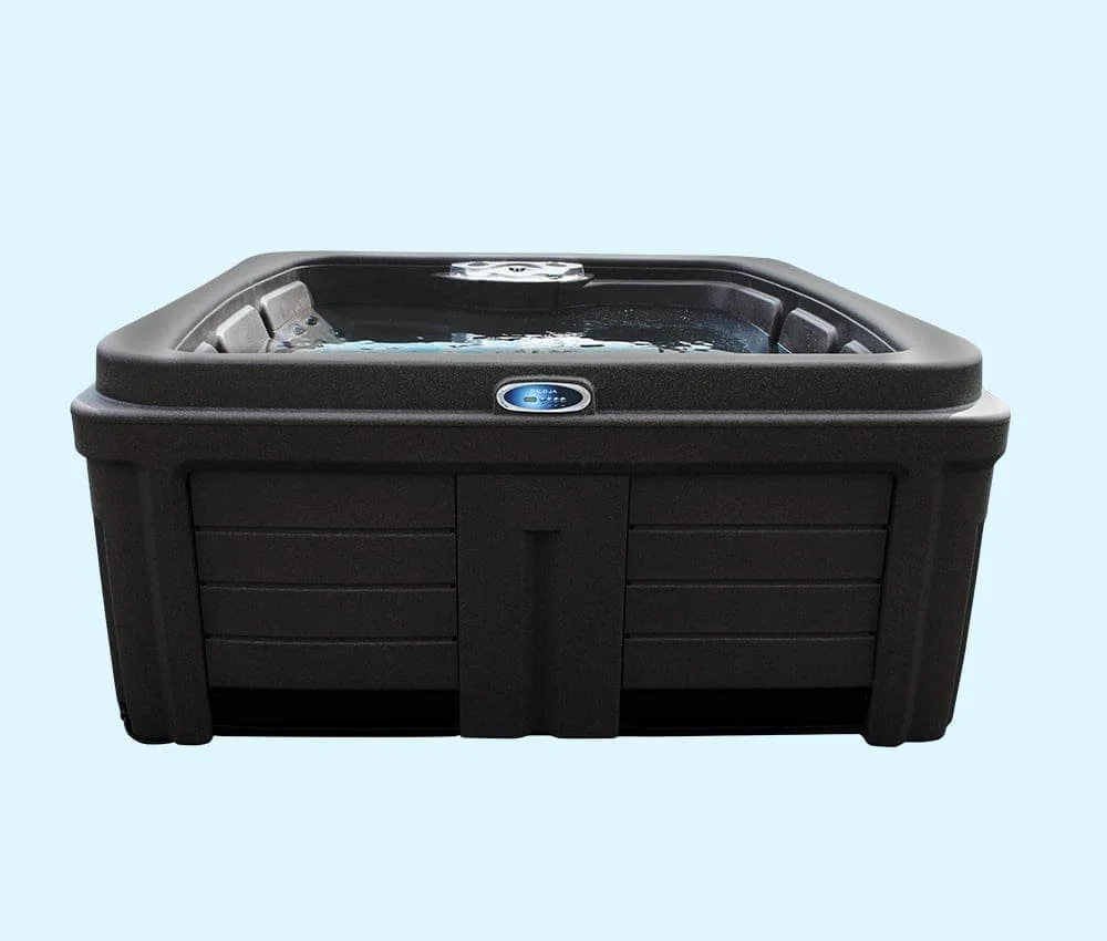 Black hot tub filled with water against a light blue background.