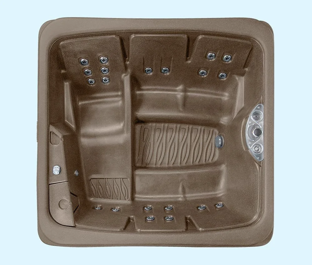 A beige therapeutic hot tub with built-in seats, jets, and control panel.
