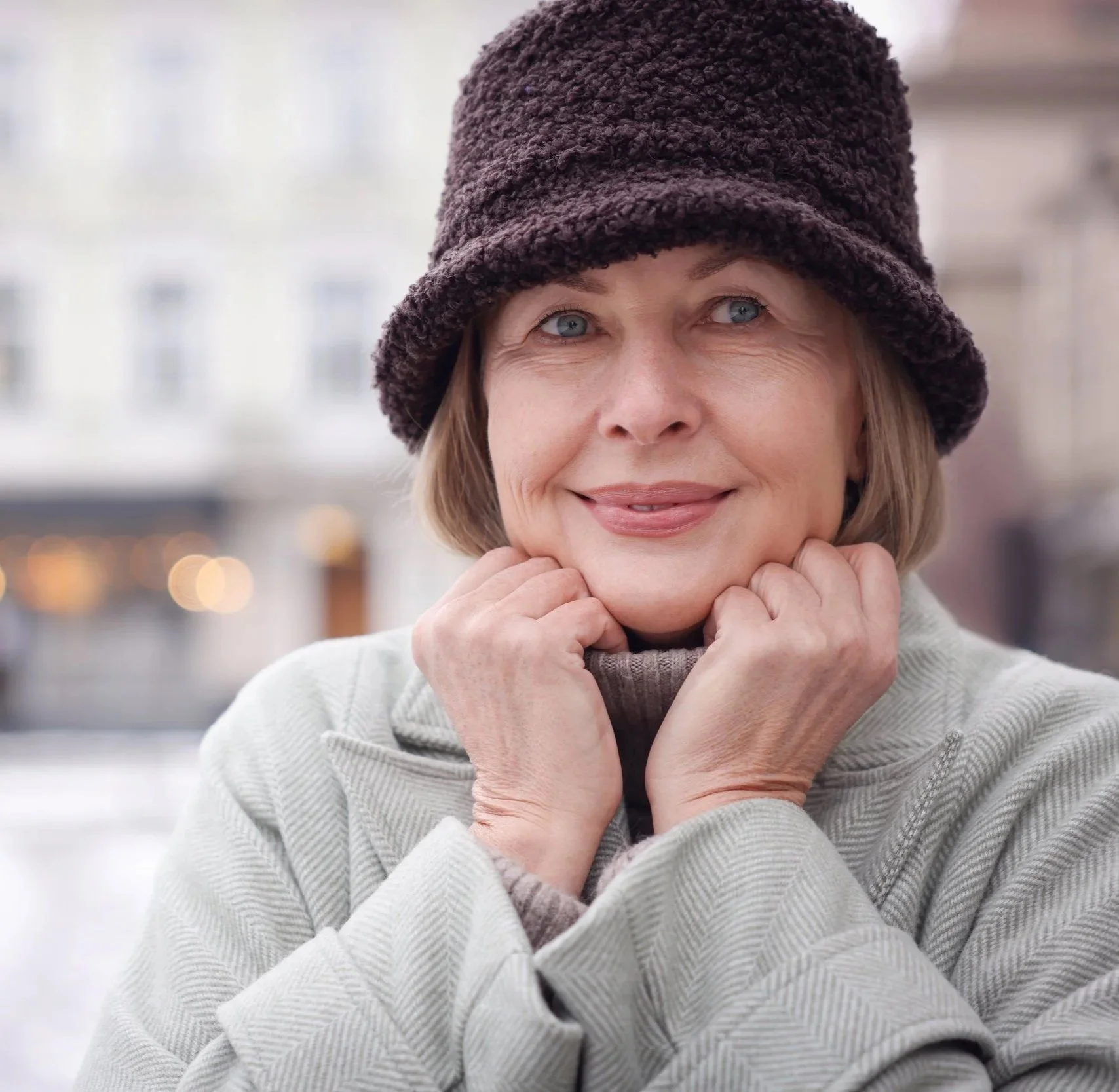 smiling-woman-in-winter-hat-standing-in-city-2026-03-27-00-39-00-utc.jpg