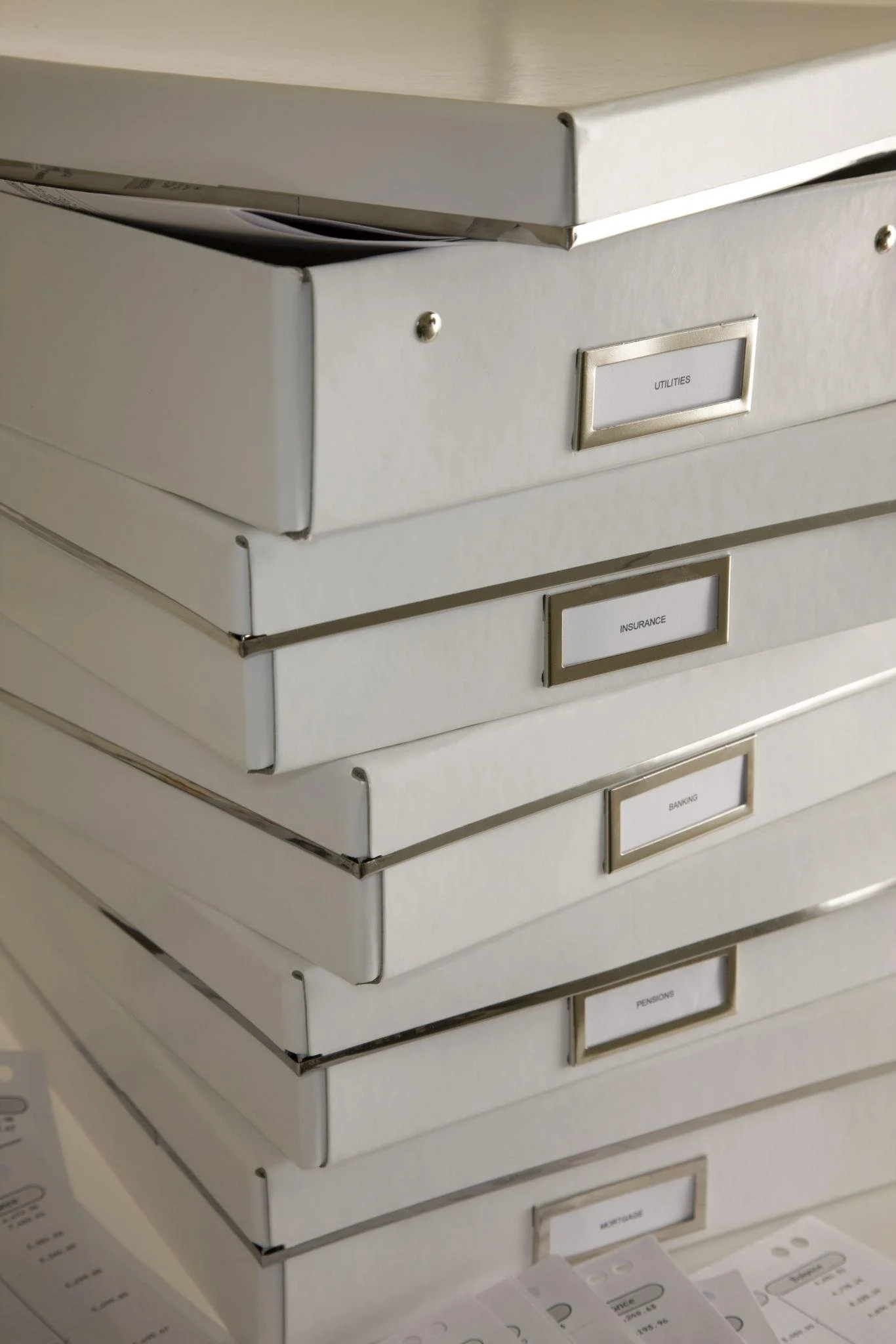 Boxes of paperwork and financial records from behind on bookkeeping in a North Carolina small business