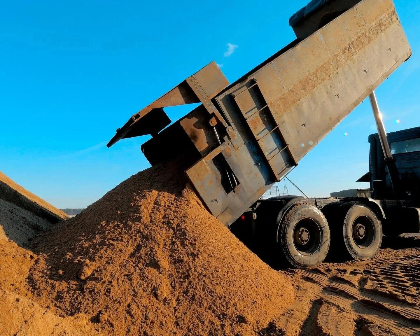 Dump truck unloading dirt construction site north carolina
