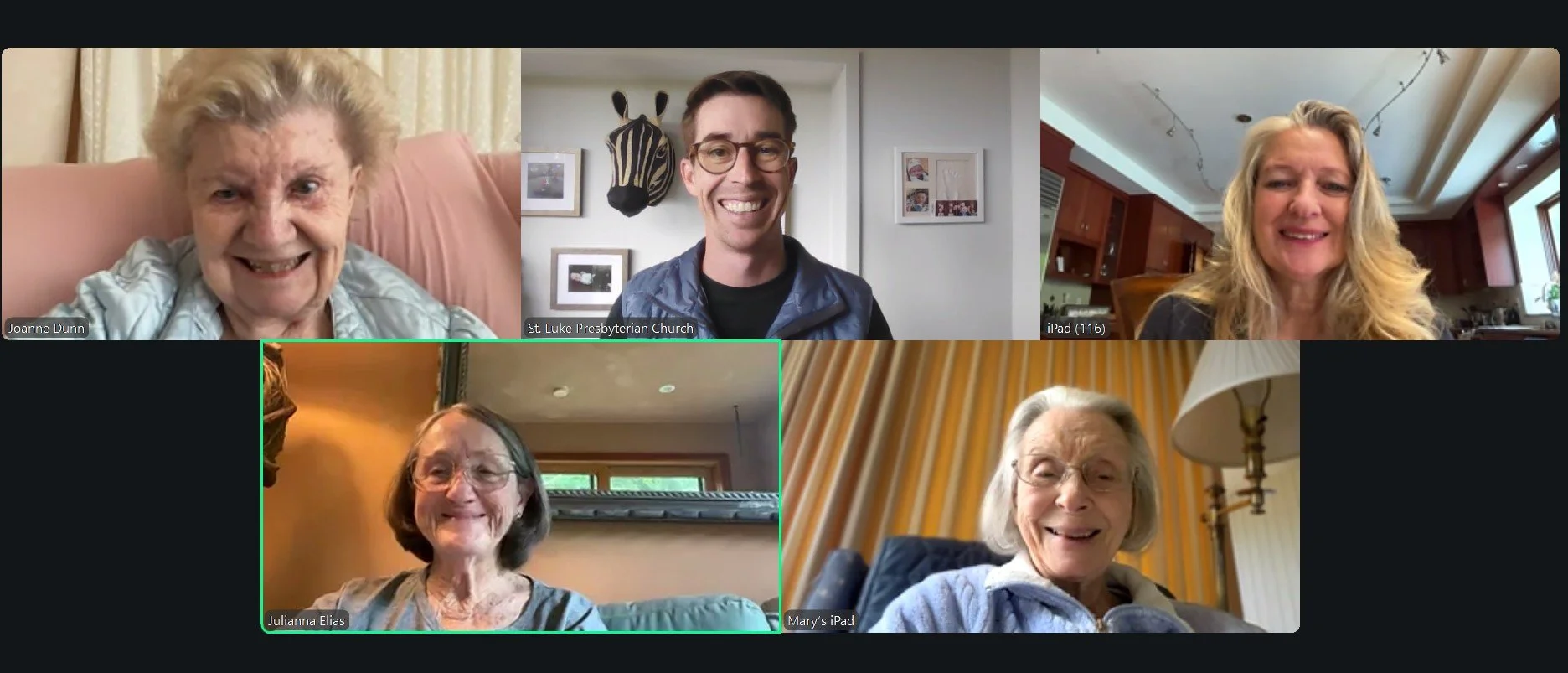 Screenshot of a virtual video call with six older and middle-aged women and one young man. The women are smiling in home or indoor settings, with backgrounds that include curtains, home decor, and paintings. The man, identified as a member of St. Luke Presbyterian Church, is smiling. Each participant appears happy and engaged in the call.