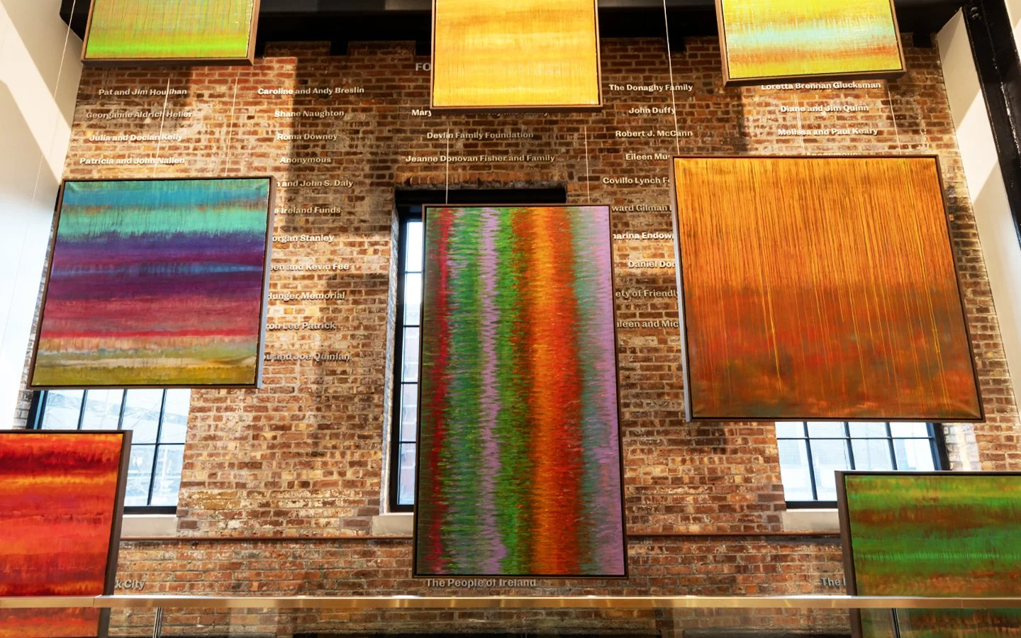 Paul Hughes abstract paintings installed in gallery space, featuring suspended colour field works with layered pigment and gradient transitions