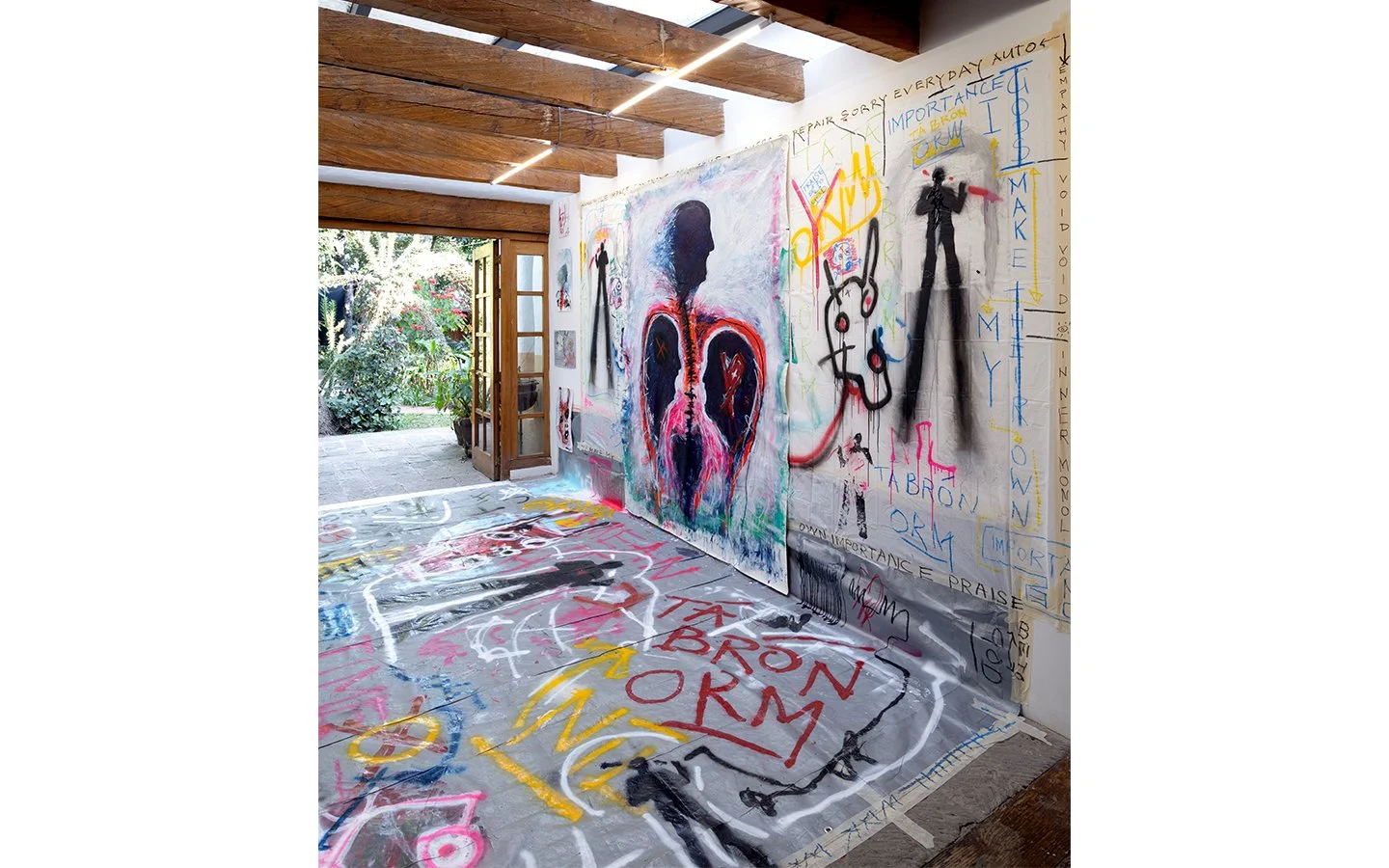 Immersive installation view of “Tá Brón Orm” by PIGSY at Casa Lü, with large figurative paintings, painted floor and open connection to exterior space