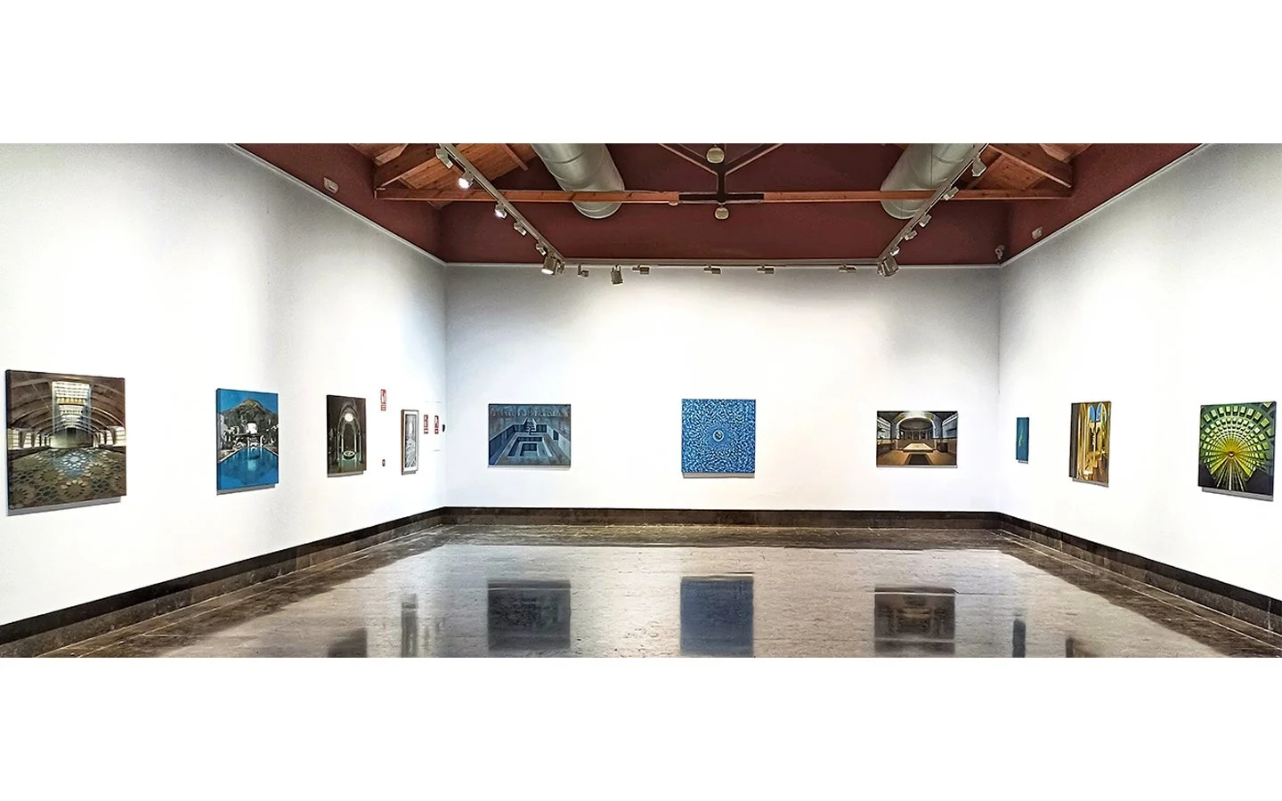 Fernando Molero exhibition installation view showing paintings within open gallery space, focusing on light, depth and constructed environments