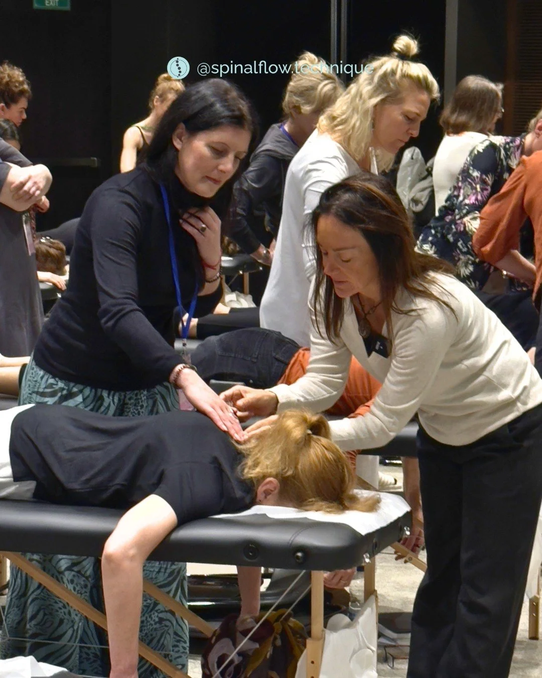 Jayne Birkett receiving hands-on practitioner training for Spinal Flow Technique in a professional workshop.