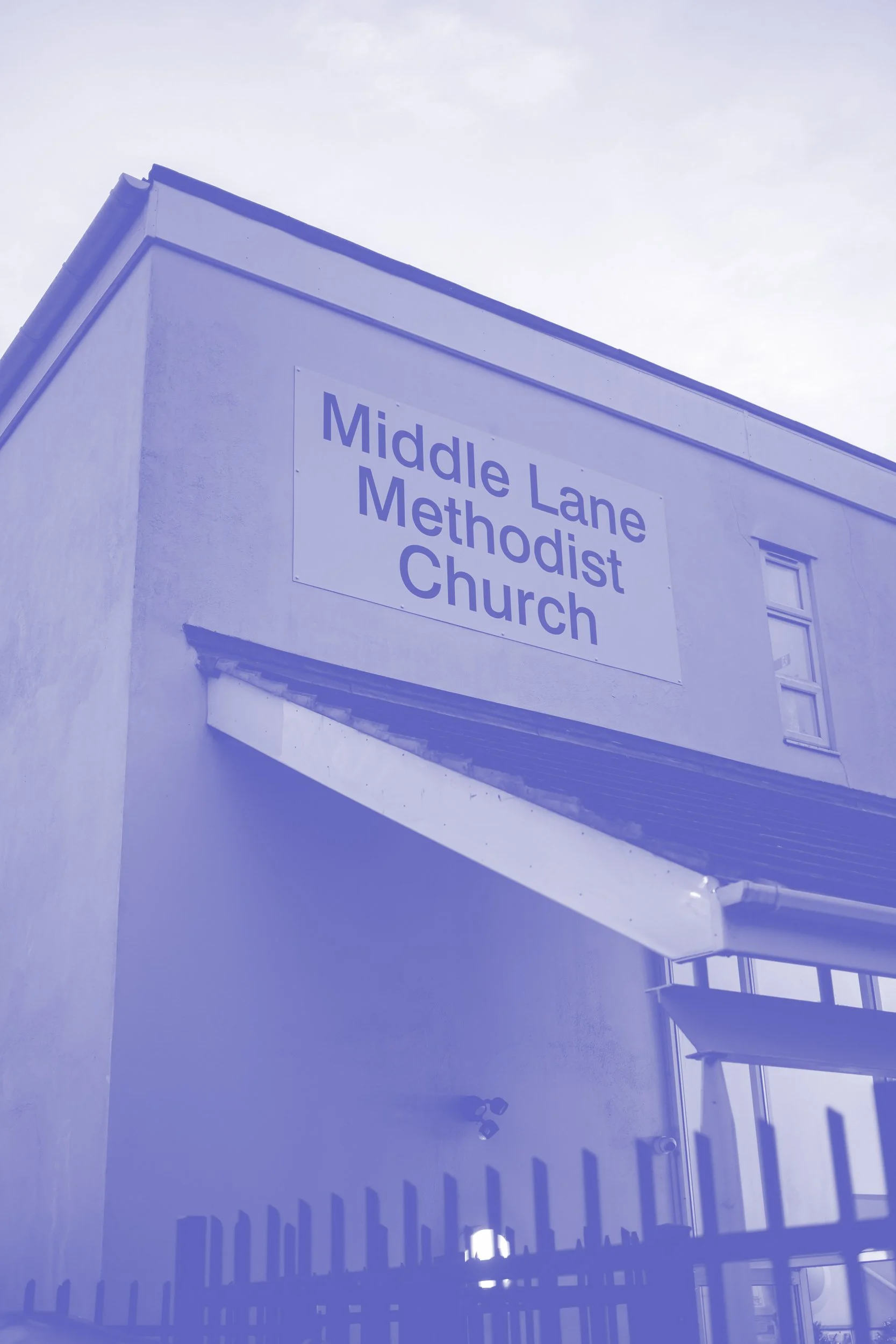 Photo of a building with a sign that reads "Middle Lane Methodist Church."