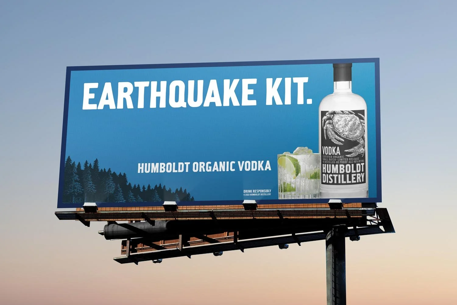 Billboard advertisement for Humboldt Organic Vodka featuring a bottle of vodka and a glass with lime slices and ice, set against a blue background with a forest silhouette, promoting earthquake preparedness.