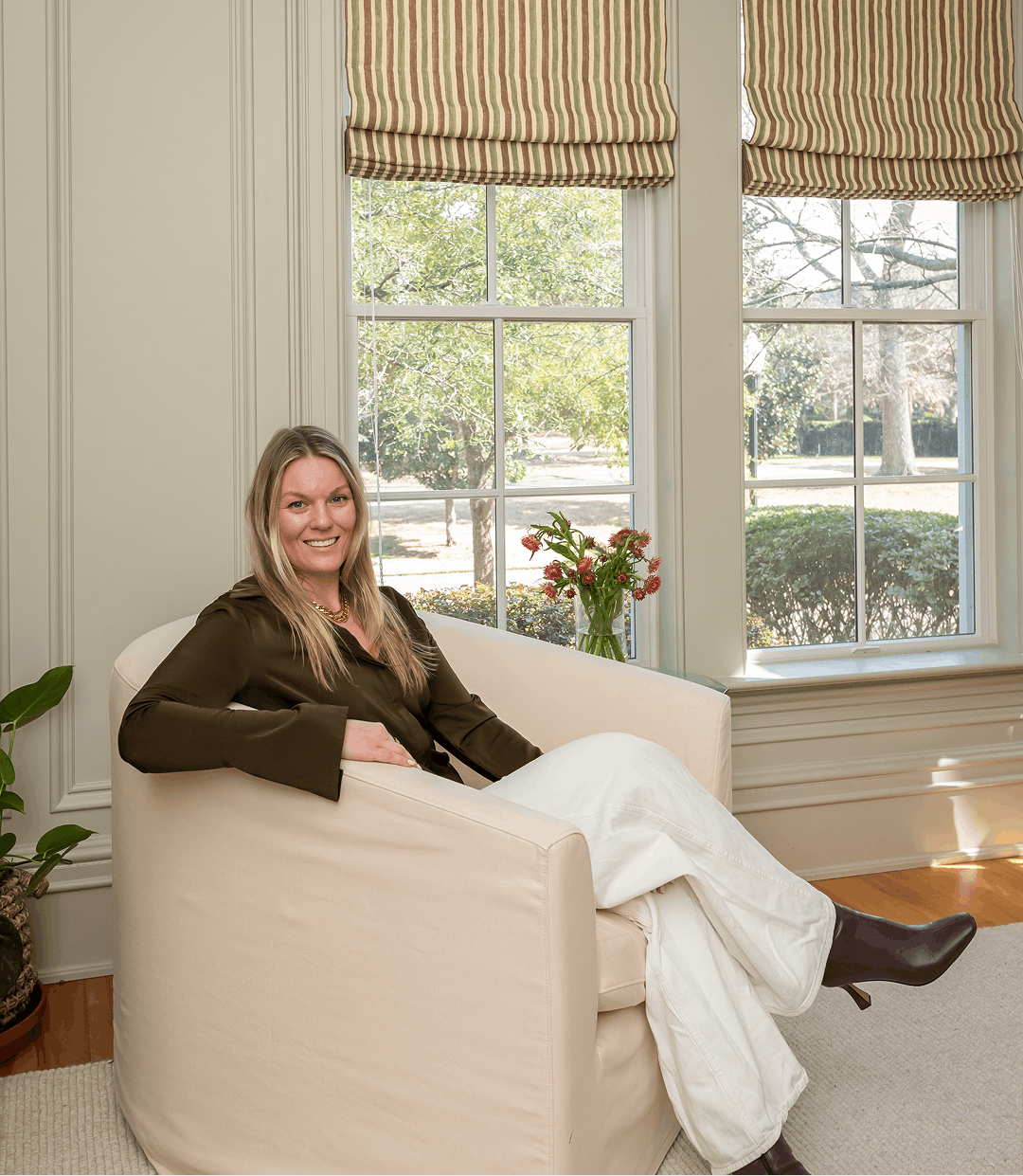 claudia leonard a luxury interior designer sitting in a connecticut house