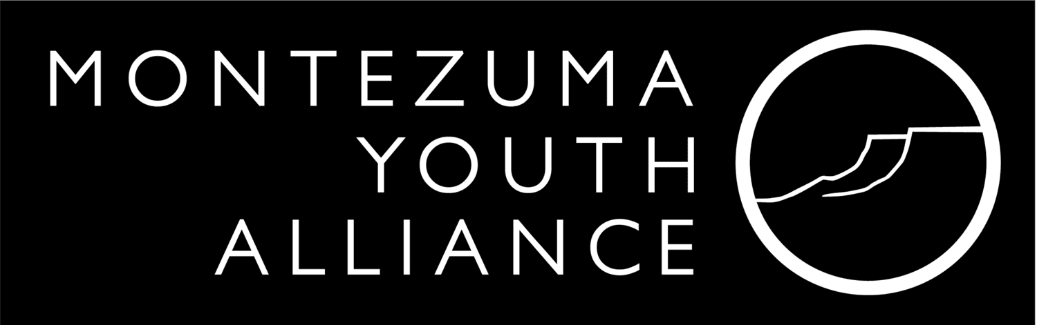 Logo of Montezuma Youth Alliance with a stylized map or diagram inside a circle.