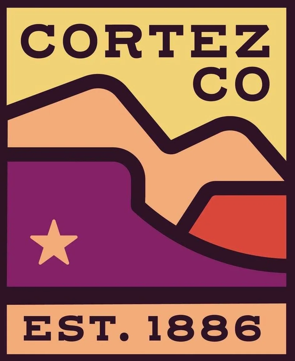 Logo for Cortez Co featuring stylized mountain range and star, with the text "Cortez Co" at the top and "Est. 1886" at the bottom.