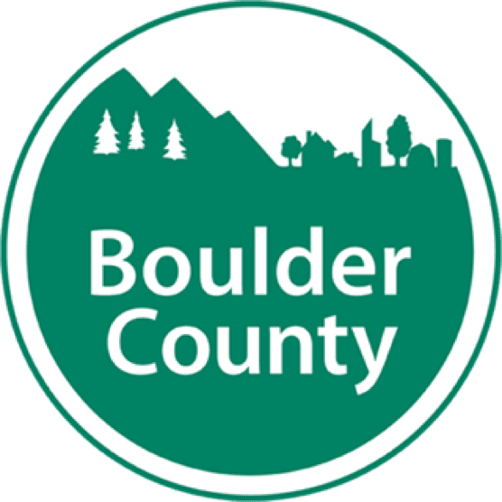 Logo of Boulder County featuring mountains, trees, and city skyline in a green and white circular design.