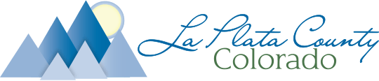 Logo for Le Flatté County, featuring stylized mountains with a sun or moon in the background, and elegant cursive text.