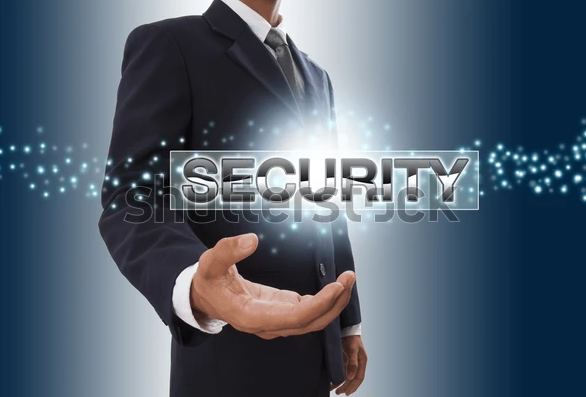 Business person holding out hand with glowing security text and digital effects