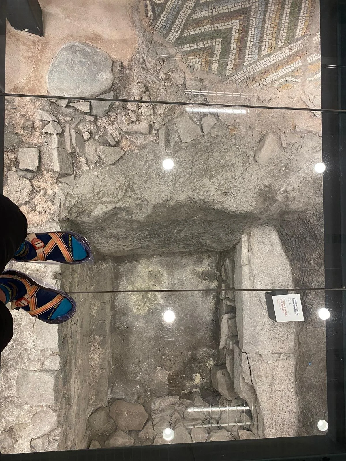 Layers of Greek and Roman marble and ruins from pagan church (also, note the preferred biking footwear).