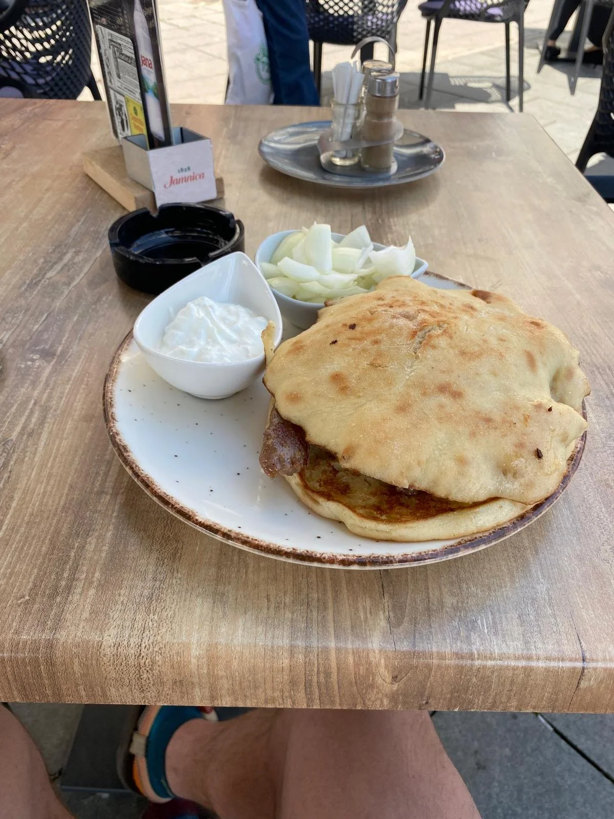 Čevape (local Balkan food, very popular in Serbia.  Sausage, raw onion, bread, and yogurt.  Massive portion sizes and quite good.)