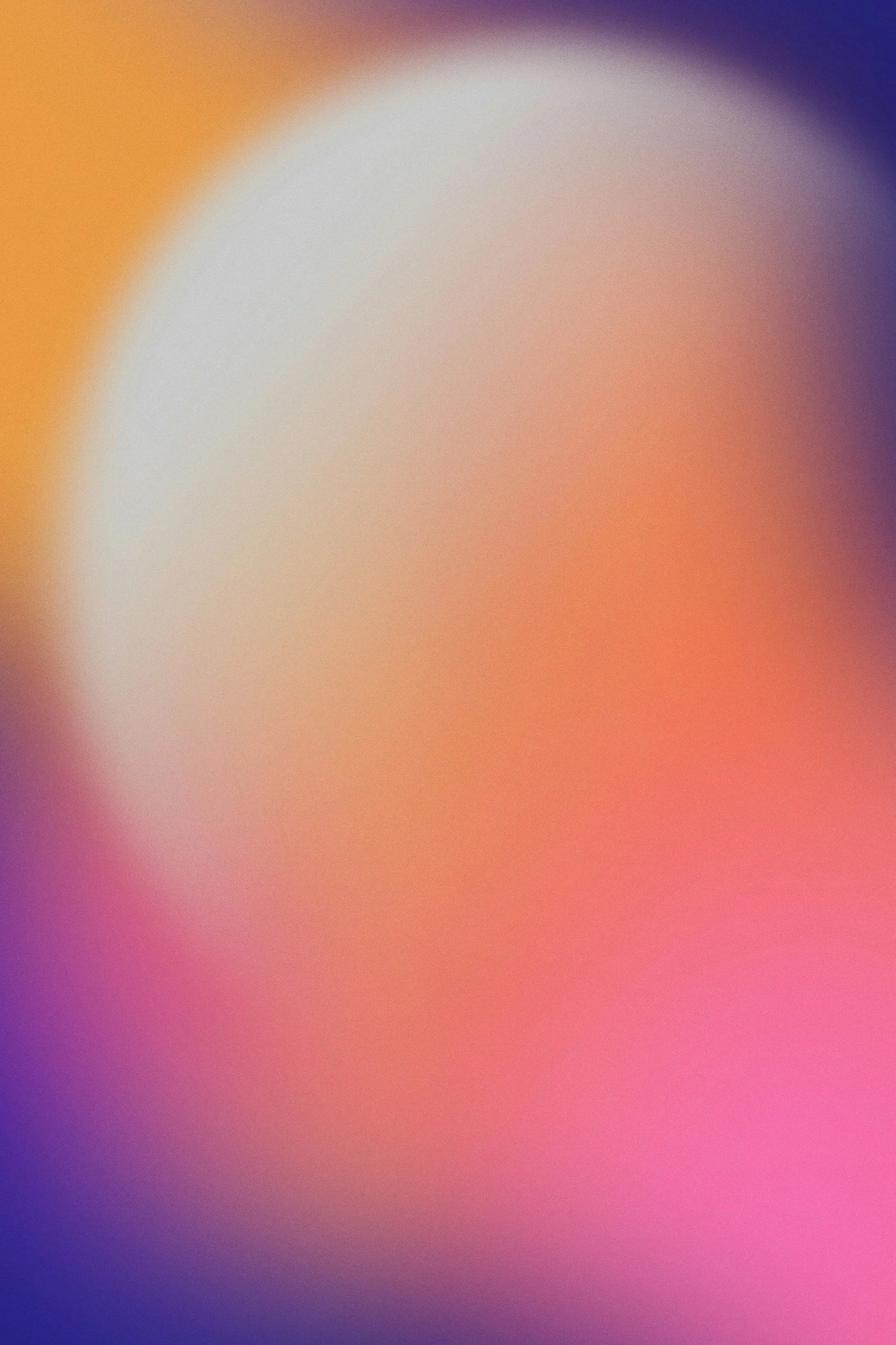 Blurry abstract image with vibrant gradient colors including purple, pink, peach, and yellow.