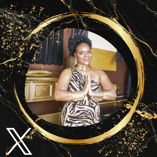 A woman with short curly hair smiling with hands in a prayer position, wearing a animal print dress and a gold choker necklace, standing indoors in front of a gold-colored background and black curtains, framed by a decorative gold and black circular border.