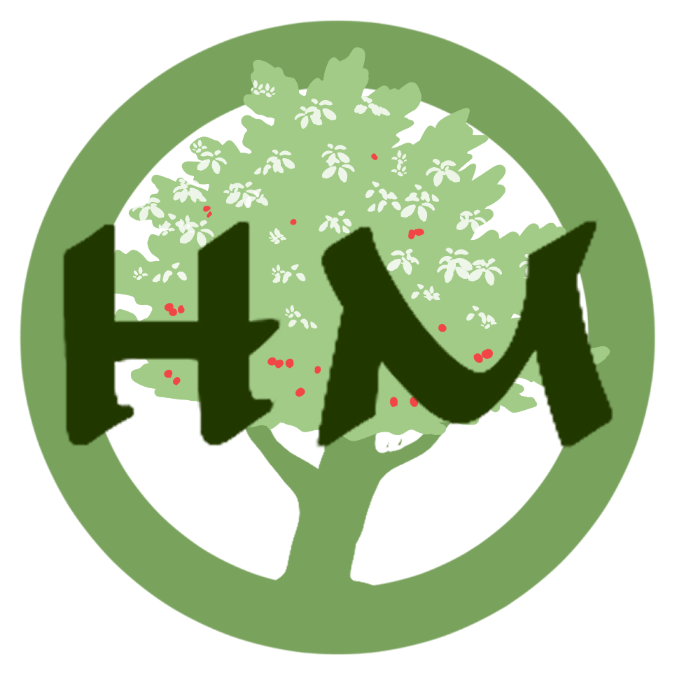 A circular logo with a green border, a large tree with red dots representing fruit or berries, and the text 'HM' in black across the tree.